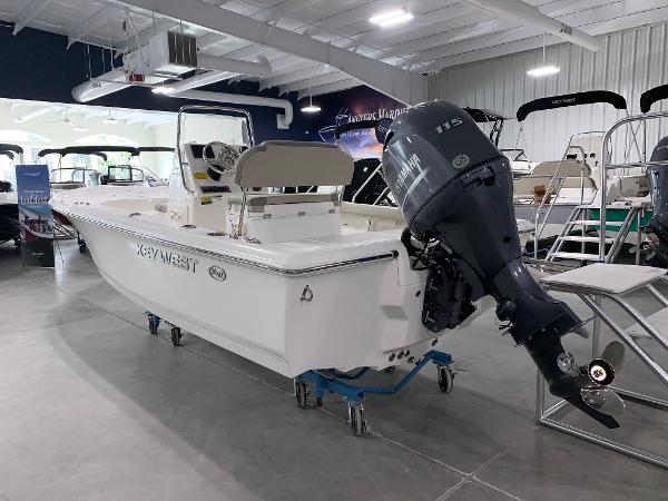 2024 Key West 188 Bay Reef boat in showroom with Yamaha outboard motor.
