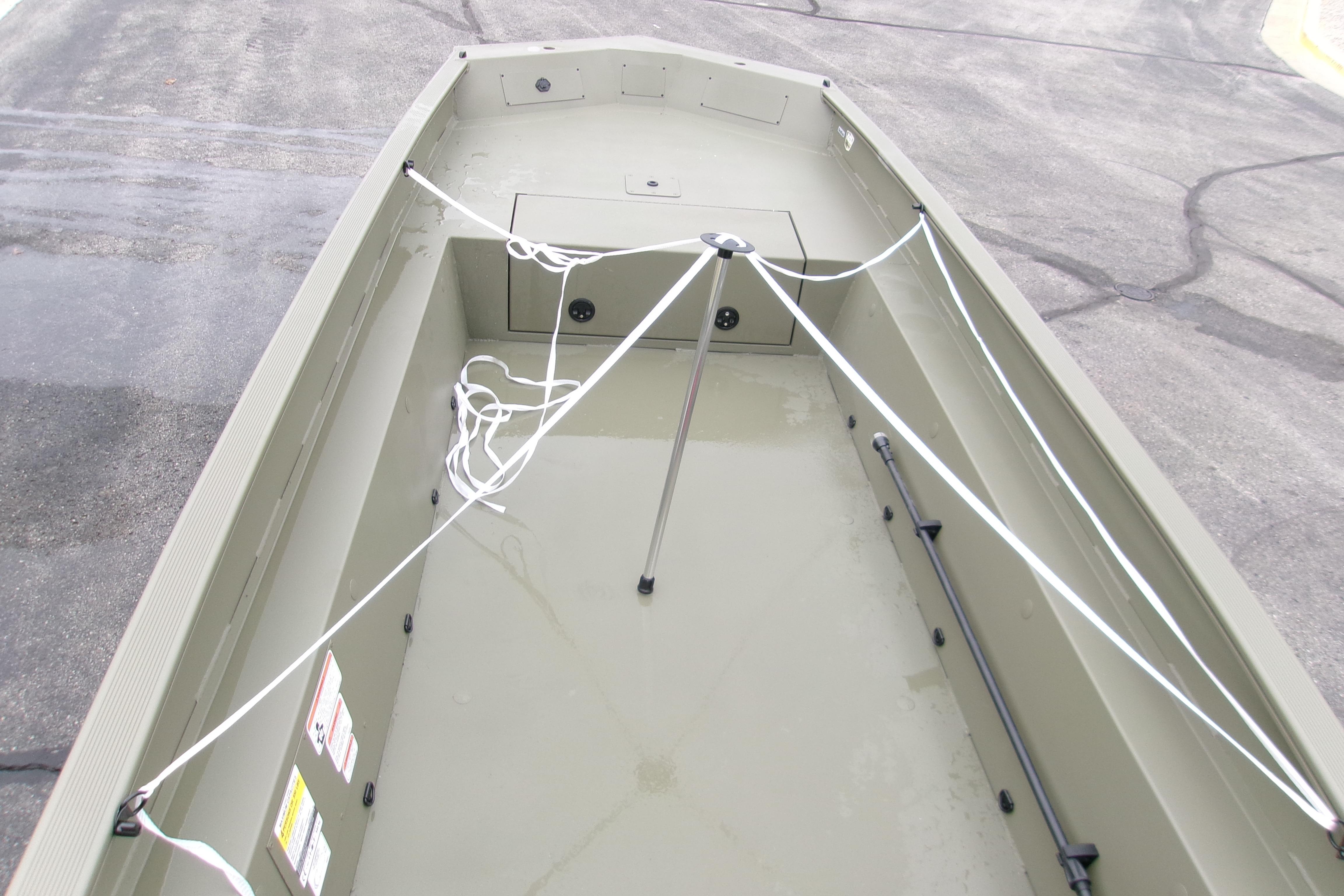 2026 Tracker Grizzly 1650 T Prairie Wings Edition boat interior, showcasing storage and seating.