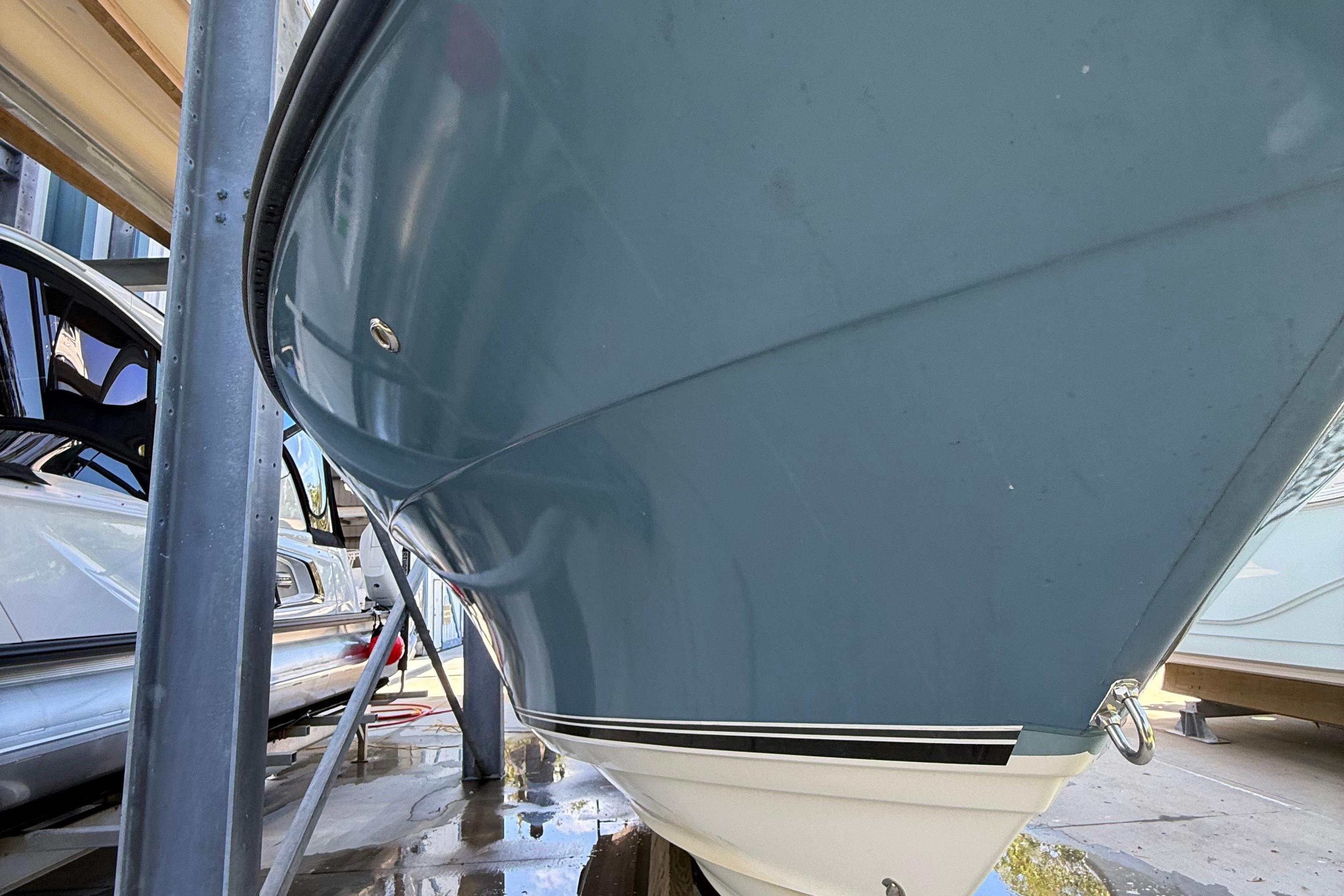 2008 Century 2901 Center Console boat hull in storage, side view.