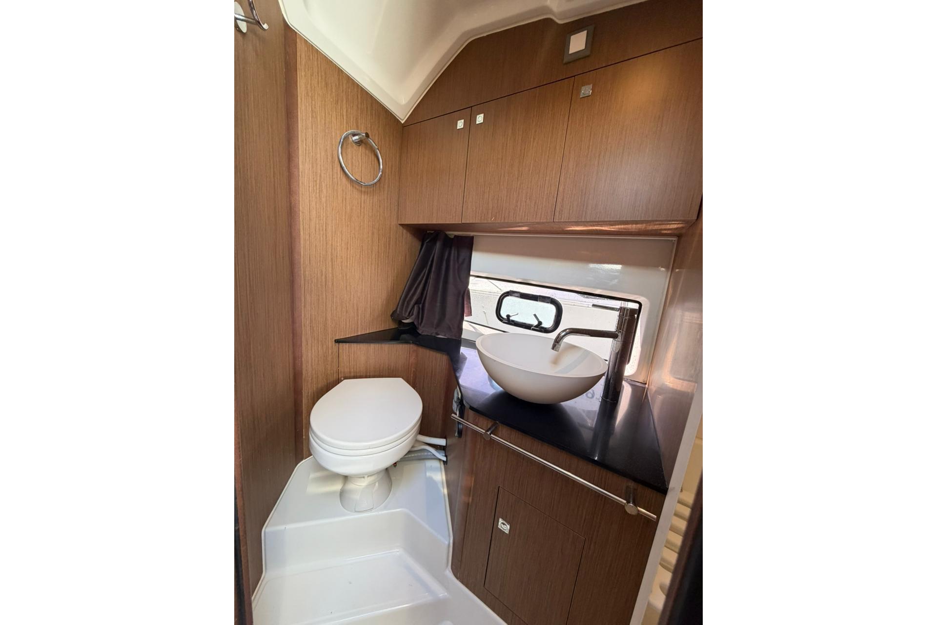 2020 Beneteau Flyer 10 bathroom with modern sink and wooden cabinetry.