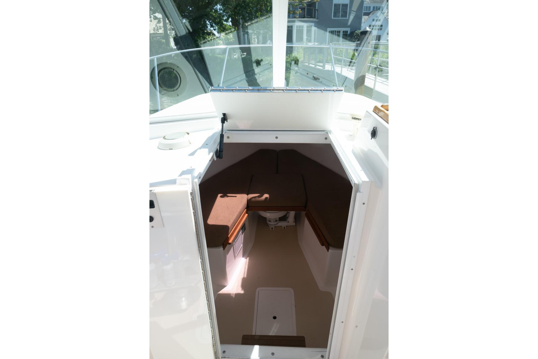 2004 Hunt Yachts Surfhunter 25 cabin interior with seating and storage.