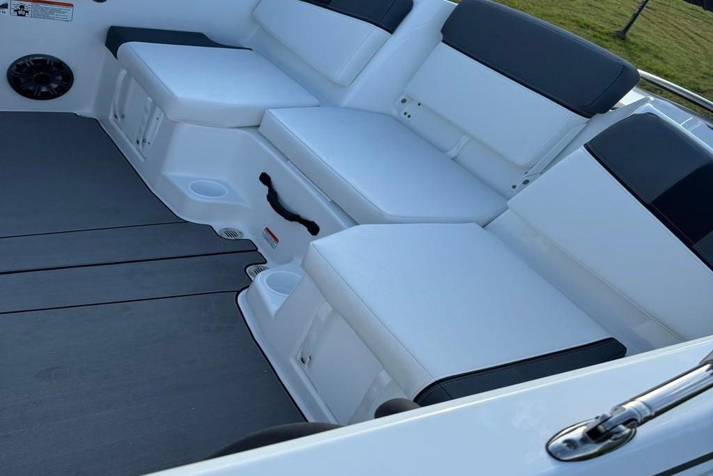 2026 Tahoe T16 boat interior with white cushioned seating and cup holders.
