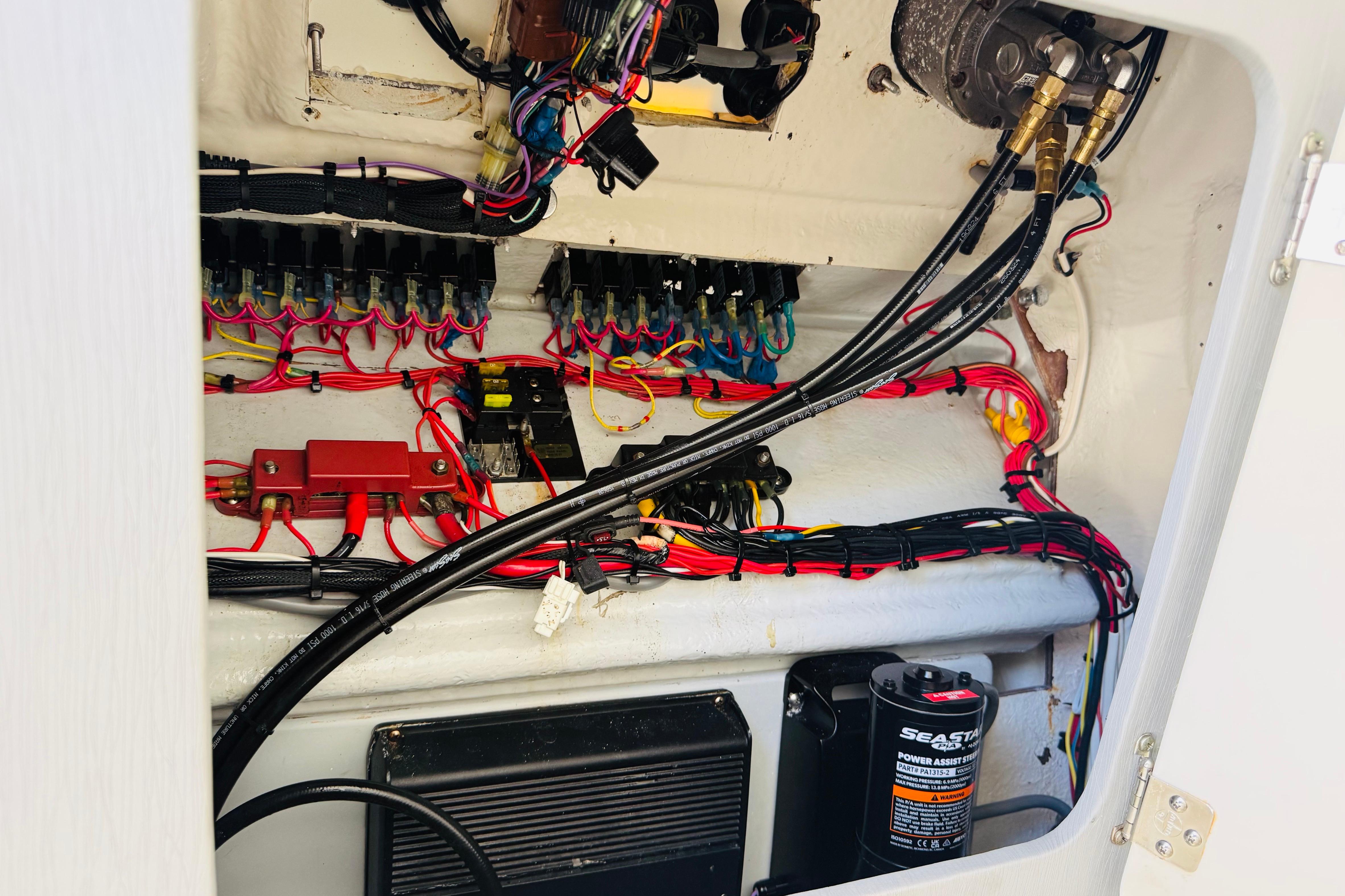 Electrical wiring and components inside a 2005 Century 3200 Center Console boat.