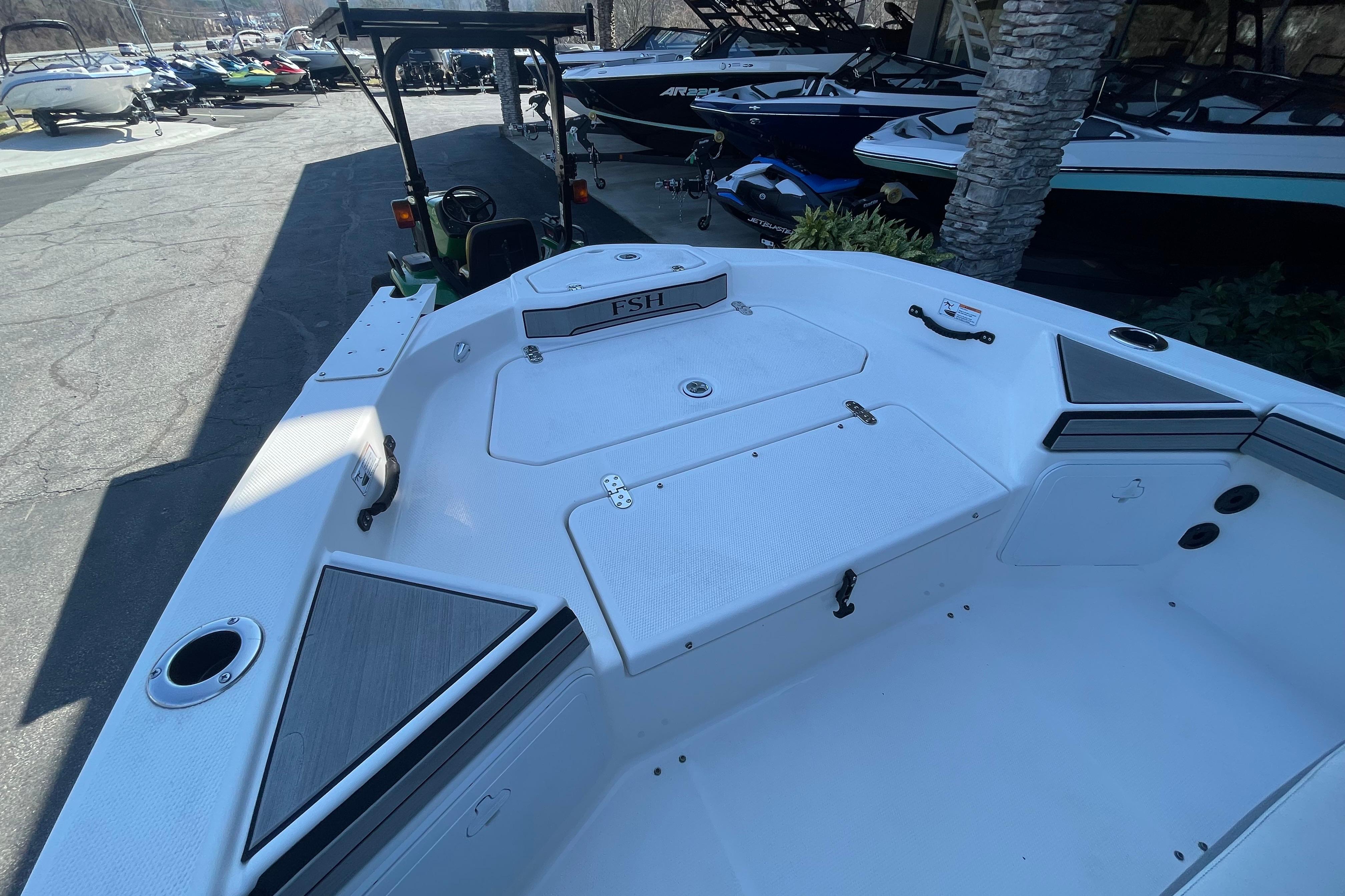 2021 Yamaha Boats 195 FSH Sport, white interior, docked with other boats.