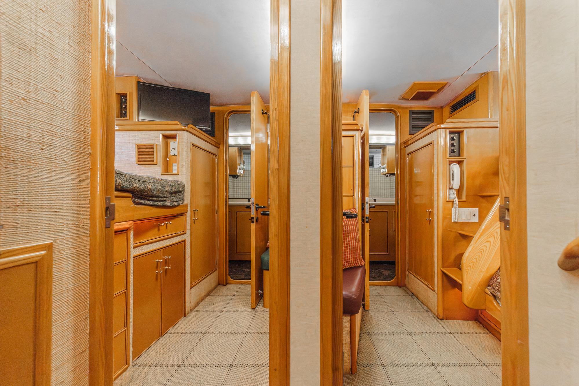Interior of 1990 Seaton Long Range Cruiser with wooden cabinetry and cozy design.