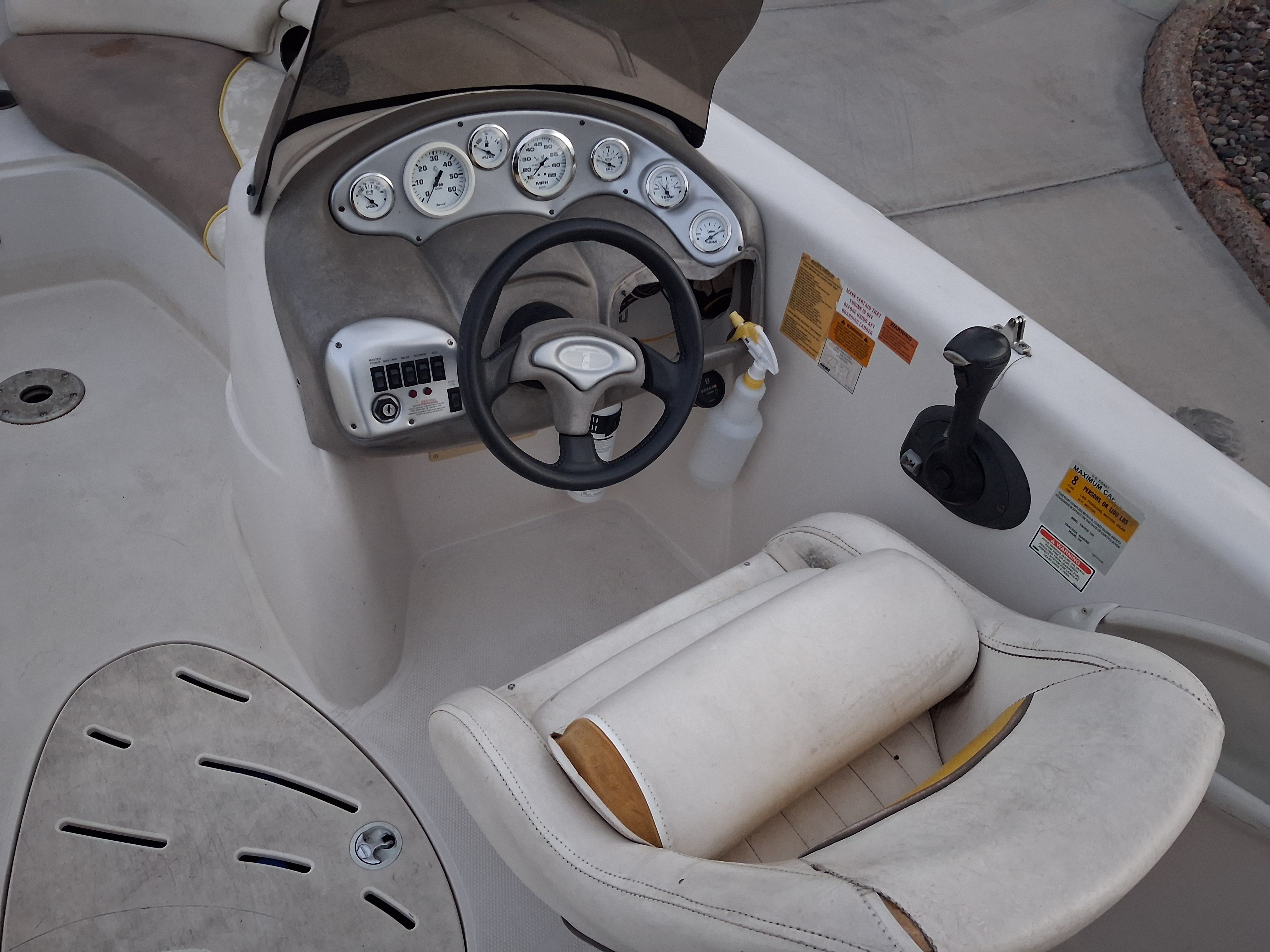 Interior of a 2004 Tracker Tahoe boat with steering console.