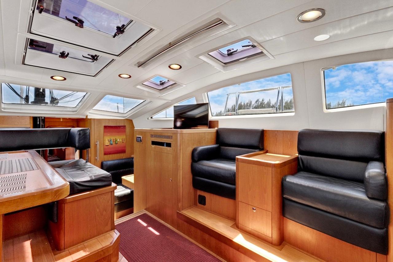Luxurious interior of 2011 Southerly 57 RS yacht with leather seating and skylights.