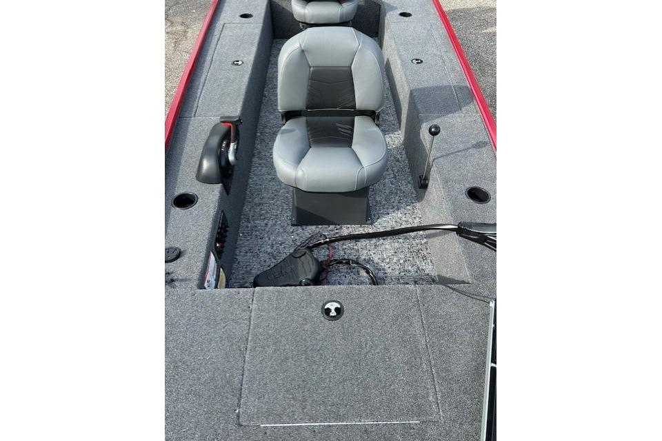 2025 Tracker Panfish 17 boat interior with gray seating and carpeted flooring.