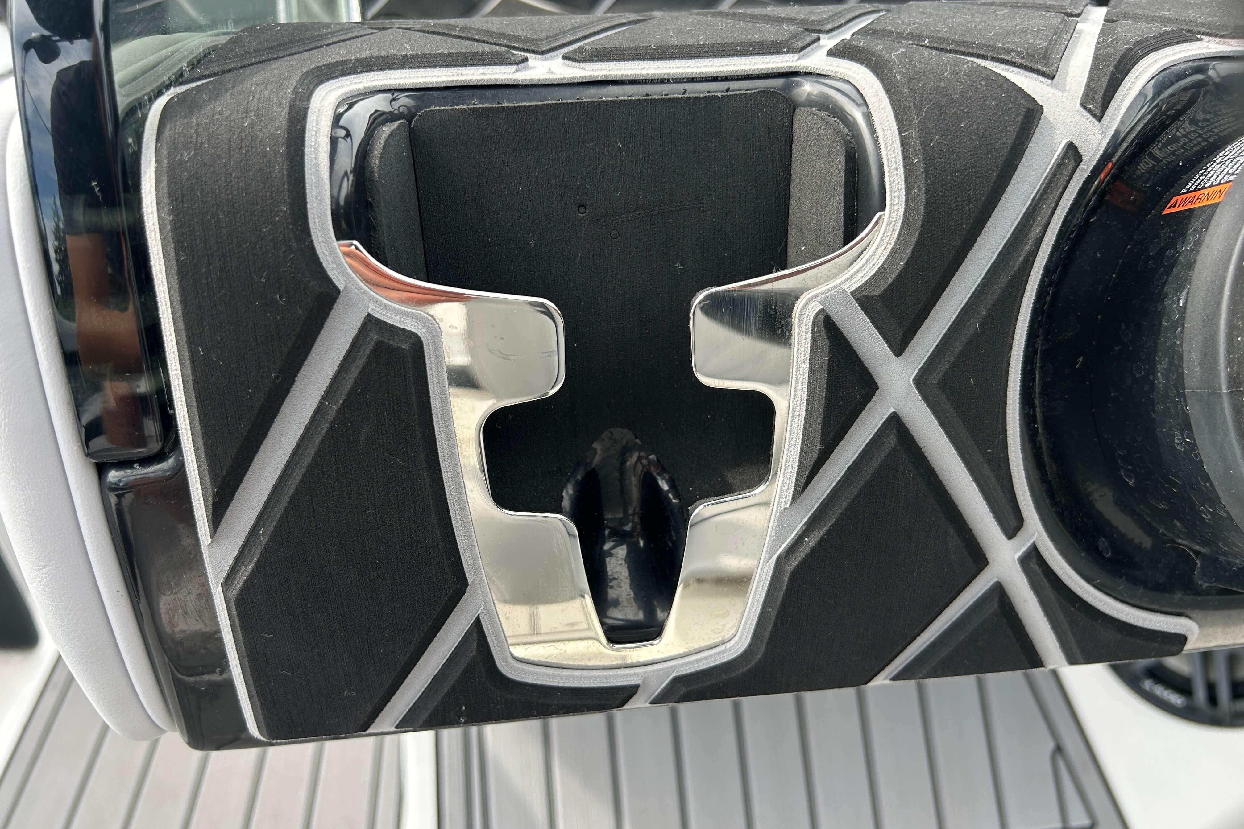 Close-up of 2021 Nautique Super Air Nautique GS24 boat detail with sleek design elements.