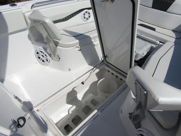 2024 Wellcraft 263 Fisherman boat interior with open storage compartment.