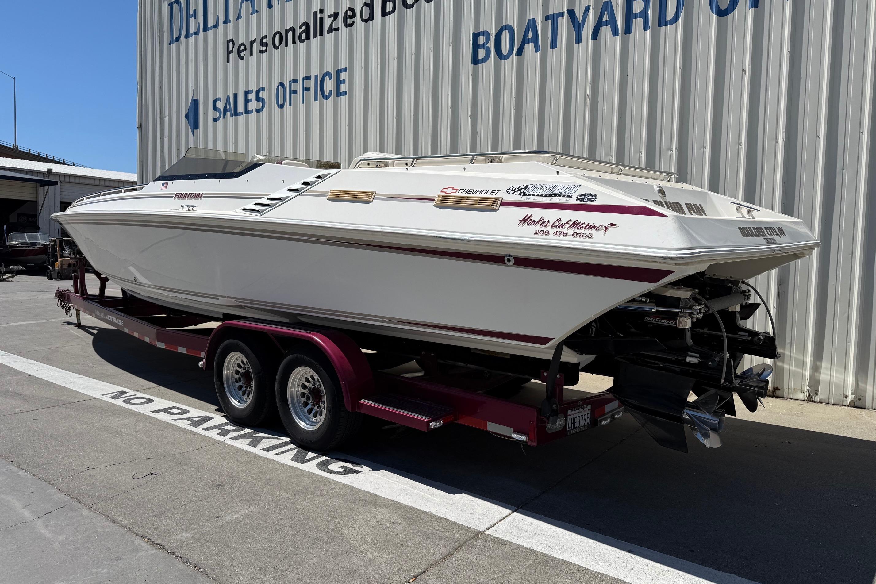 1998 Fountain 35 Lightning boat on trailer outside sales office.