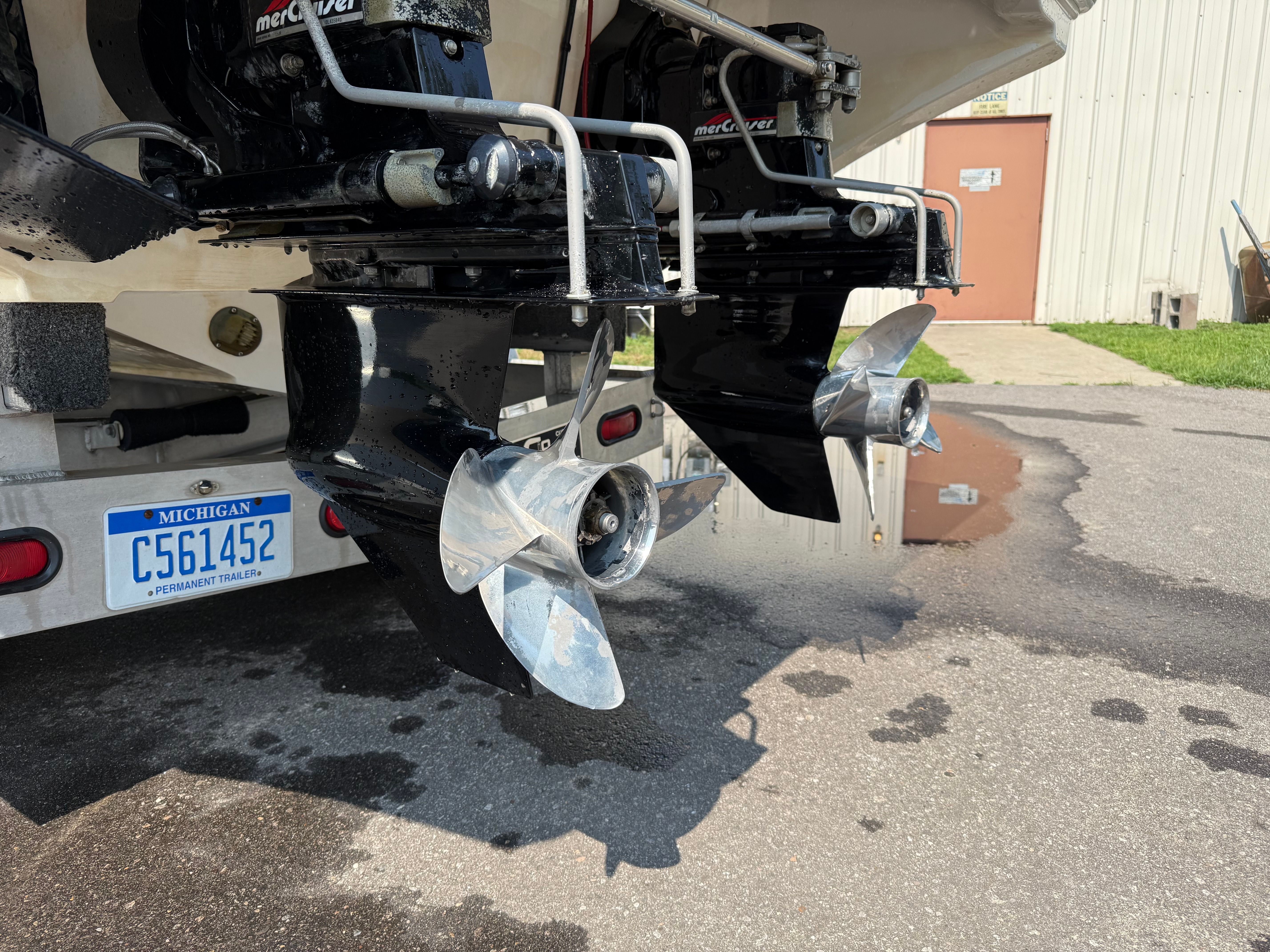 Rear view of 1999 Fountain 32 Sport Fish Cruiser with dual engines.