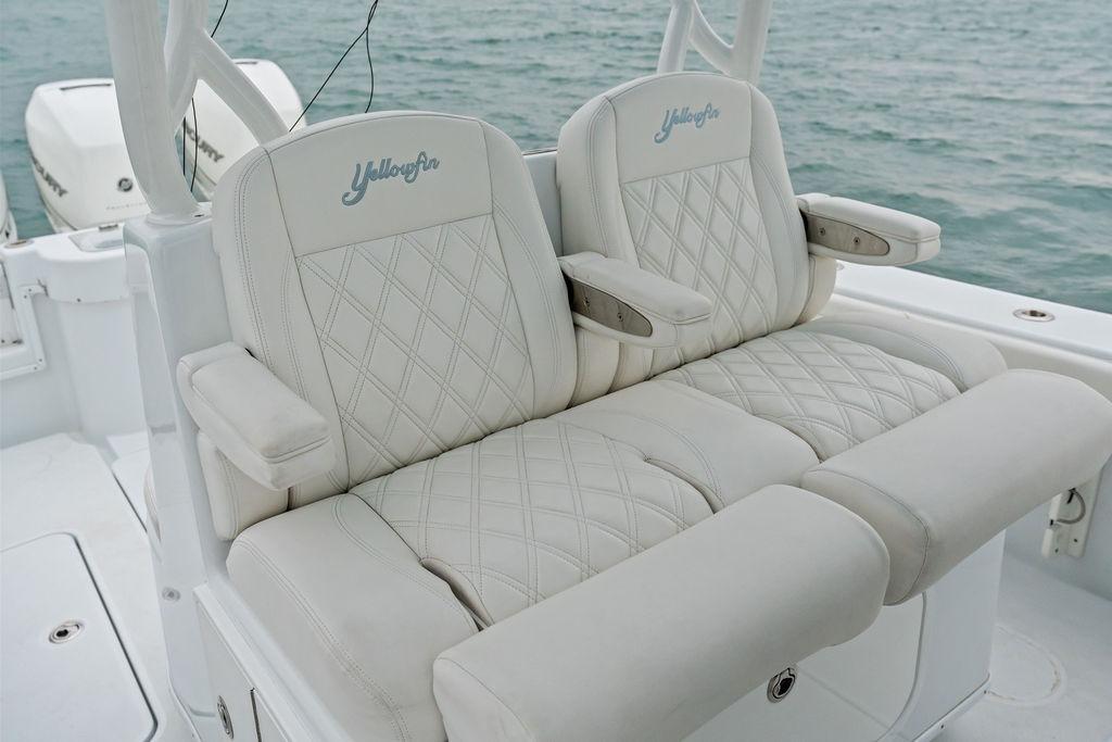 Luxurious seating on 2021 Yellowfin 36 Offshore boat with diamond-stitched upholstery.