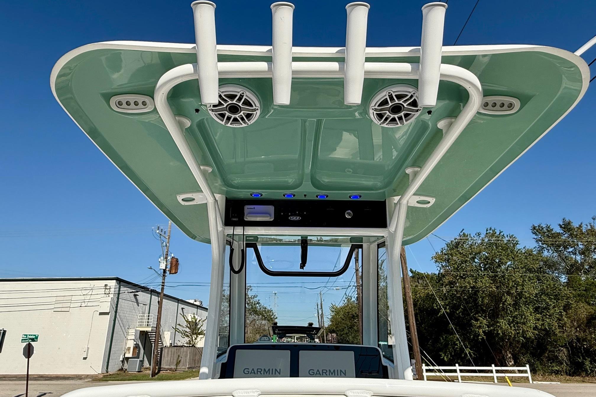 2026 Sea Hunt Ultra 255 SE boat with T-top, speakers, and Garmin electronics.