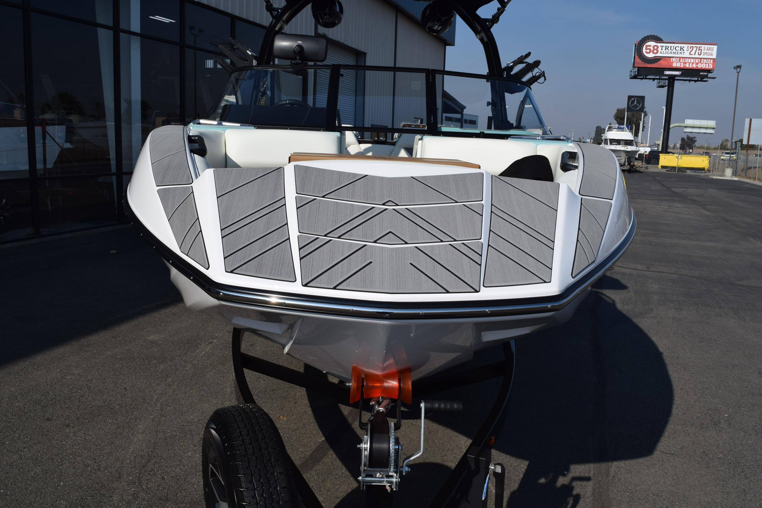 2025 Moomba Mojo boat on trailer, featuring sleek design and modern detailing.