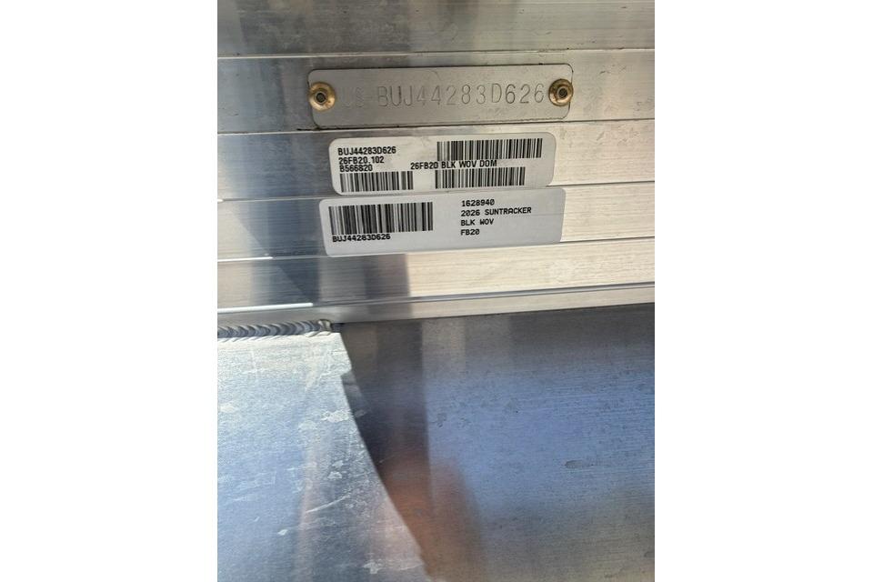 2026 Sun Tracker Fishin' Barge 20 DLX identification plate with serial numbers and barcodes.