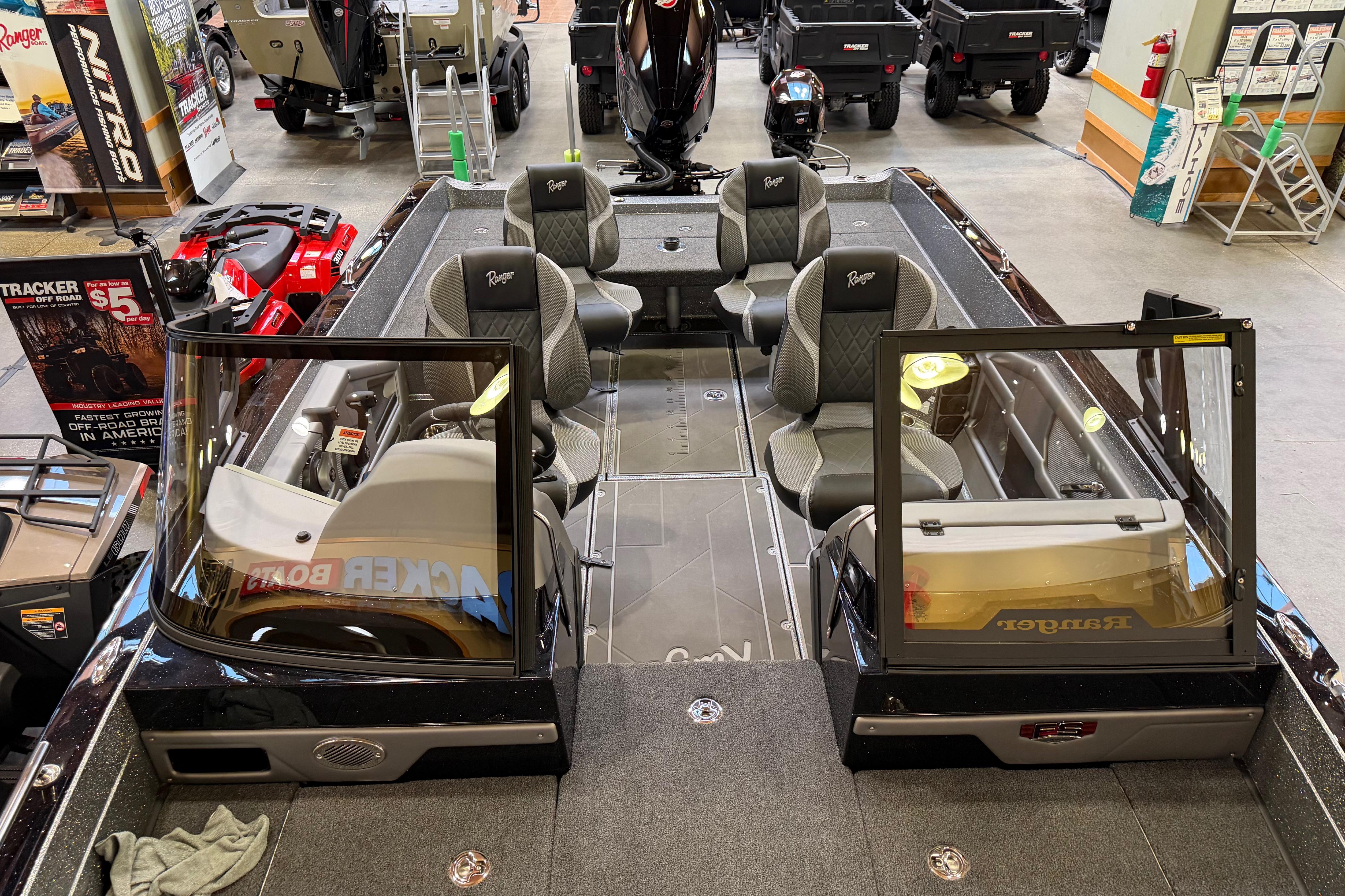 2026 Ranger 621FS Cup-Equipped boat interior with seating and dashboard, displayed in showroom.