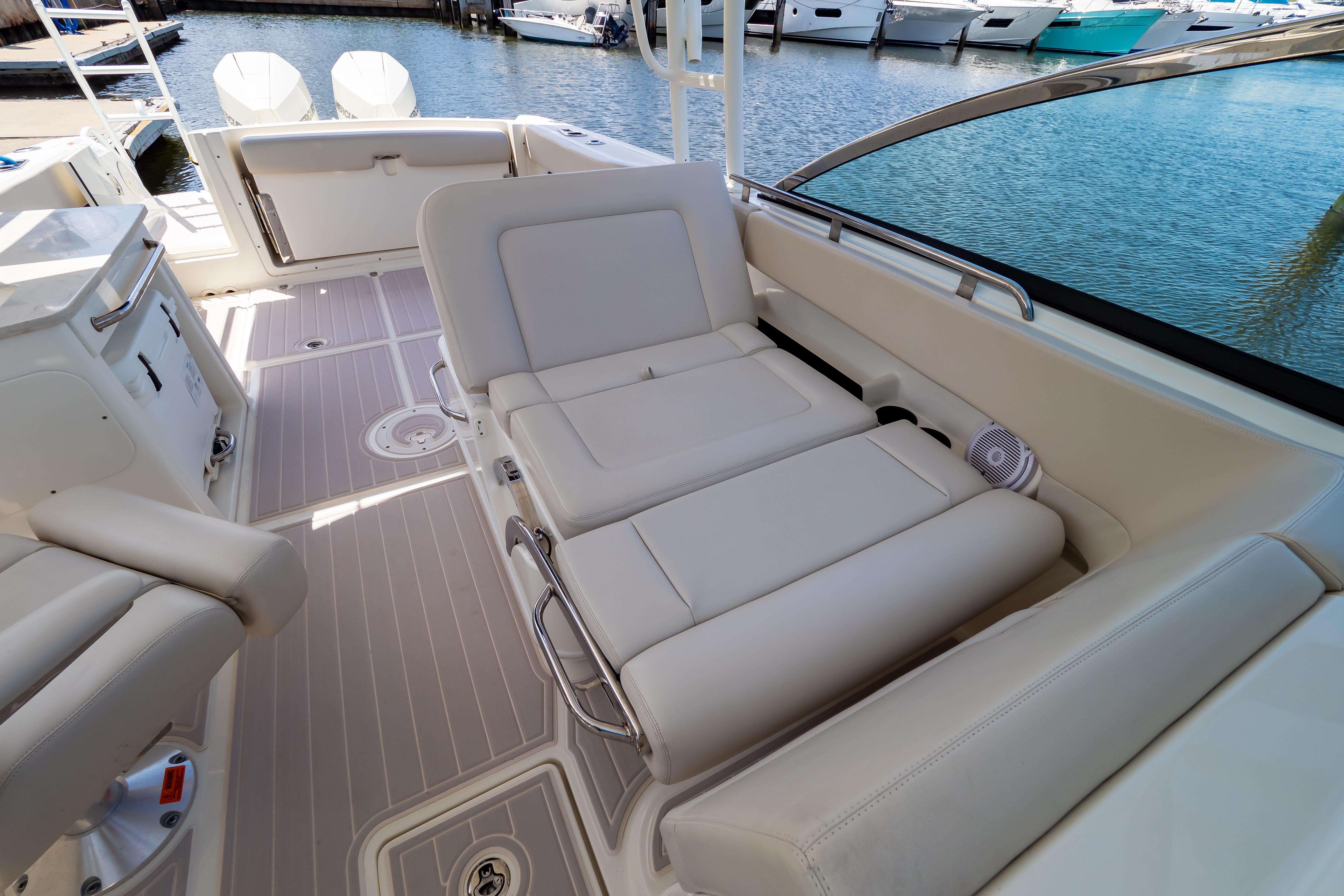 2019 Boston Whaler 270 Vantage interior with luxurious seating and waterfront view.