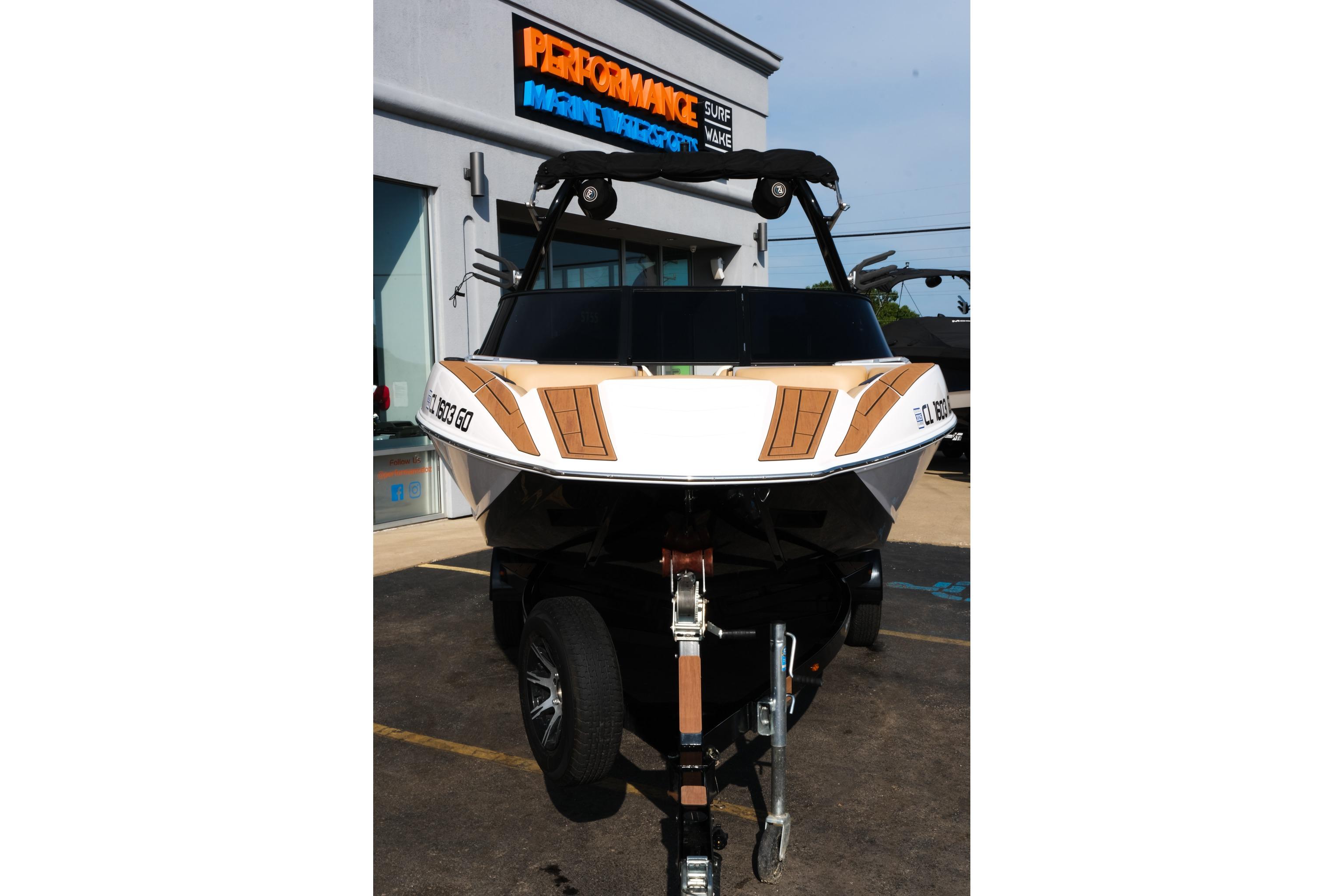 2023 Moomba Mondo boat on trailer outside dealership, showcasing sleek design and modern features.