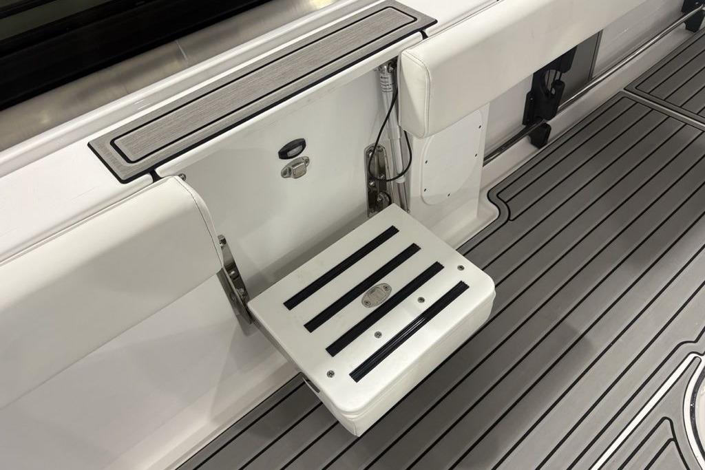 2026 Tidewater 3100 Carolina Bay boat with foldable step and sleek deck design.
