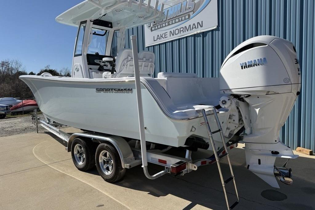 2026 Sportsman Open 232 Center Console boat with Yamaha engine on trailer.