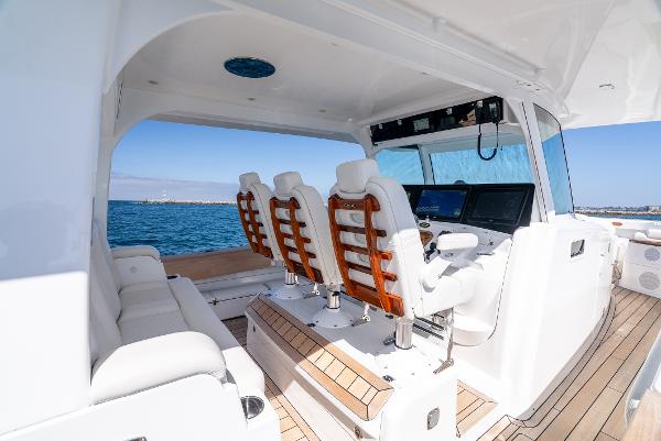2020 HCB 53 Sueños yacht interior with luxurious seating and navigation controls.
