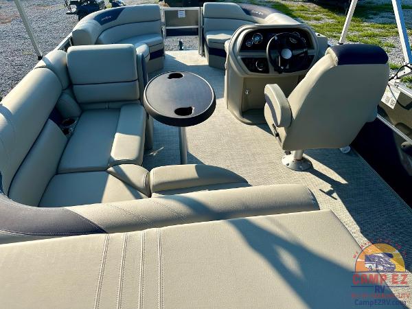 2025 South Bay 224FCR LE pontoon boat interior with plush seating and captain's chair.