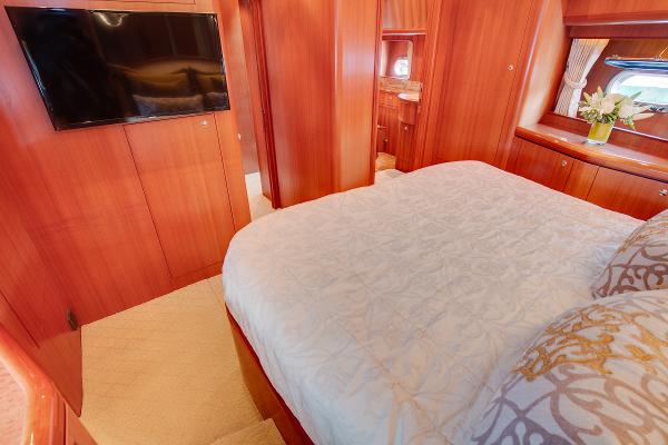 Luxurious bedroom in a 2006 Horizon 82’ Cockpit Motoryacht.