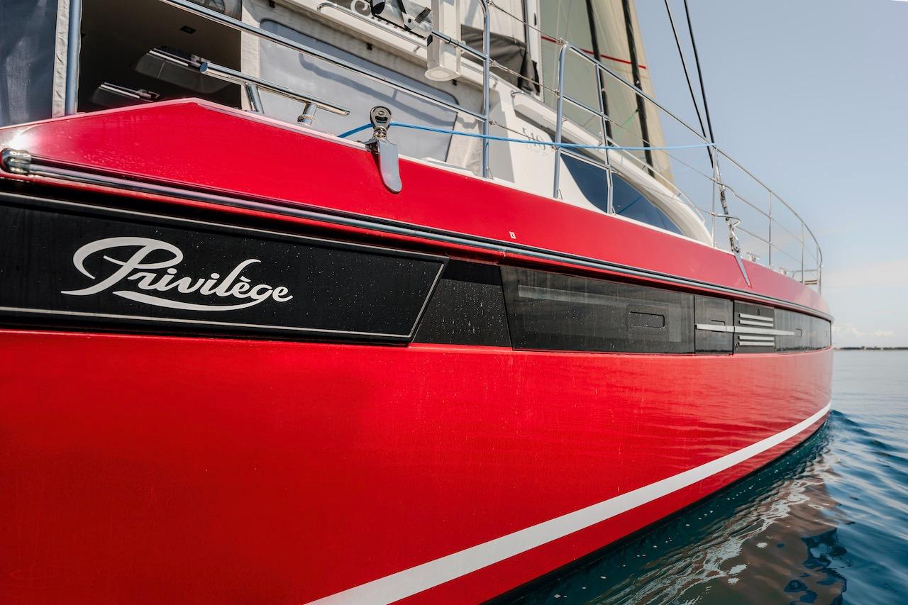 Red Privilege Signature 510 yacht, 2025 model, on calm water.