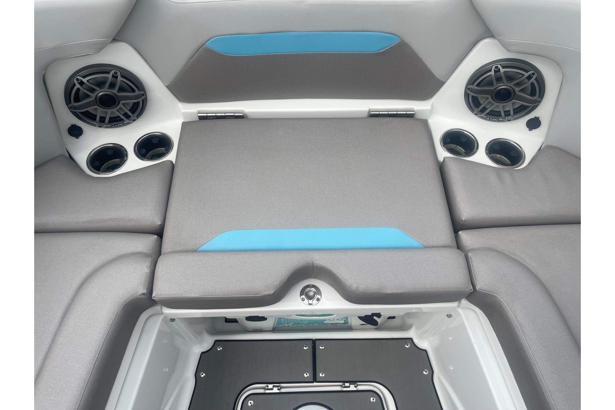 2025 Hurricane Center Console 24 OB boat interior with speakers and cushioned seating.