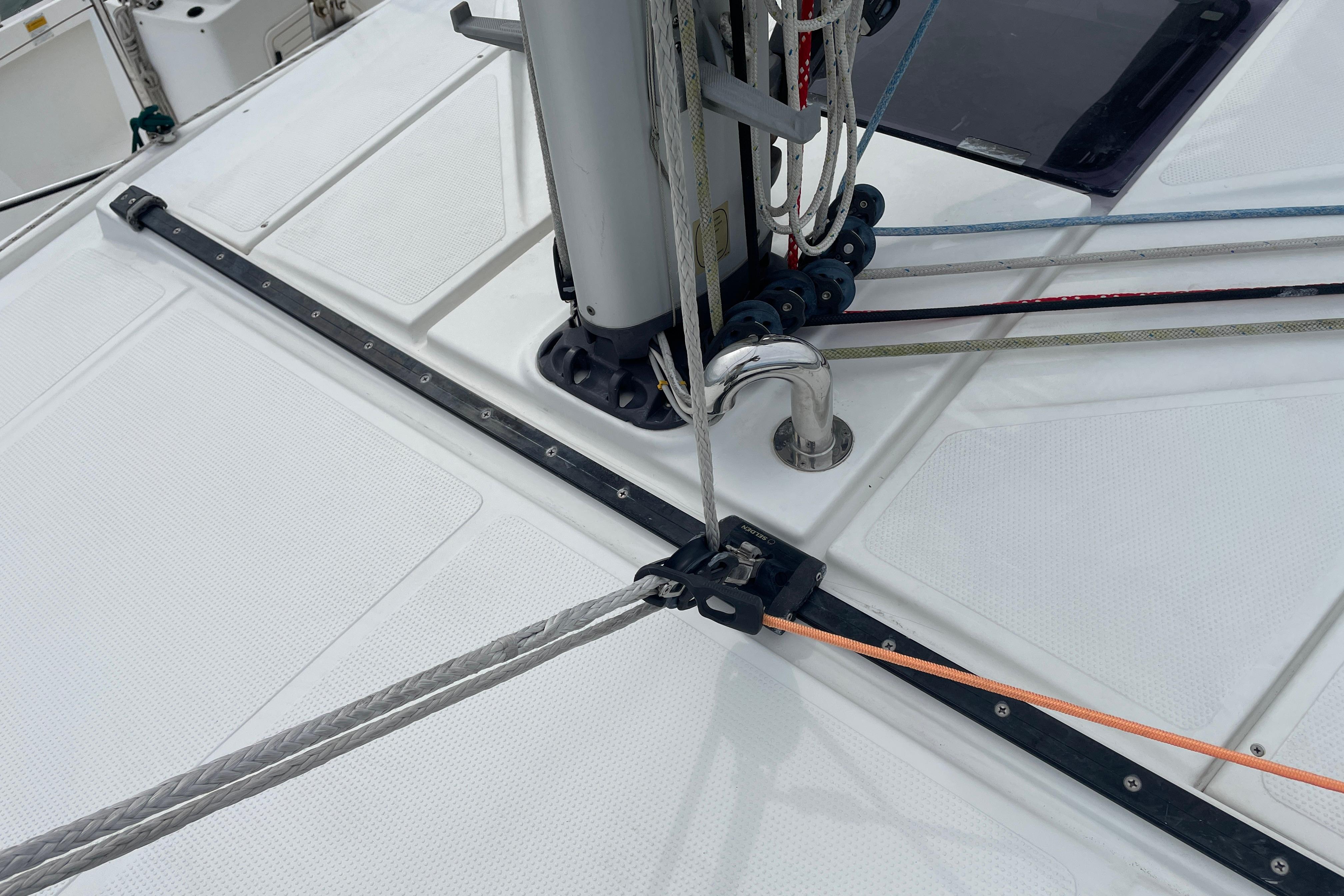 Deck of 2014 Hanse 415 sailboat with rigging and ropes.