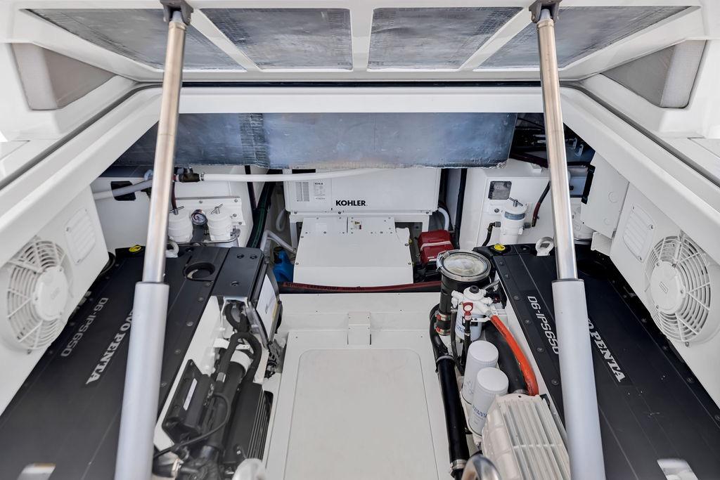 Engine room of 2021 Bluegame BG 42 yacht, featuring Volvo Penta engines and Kohler generator.