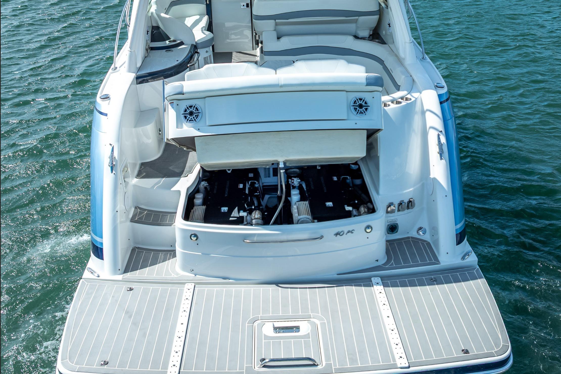2022 Formula 40 Performance Cruiser with open engine compartment on water.