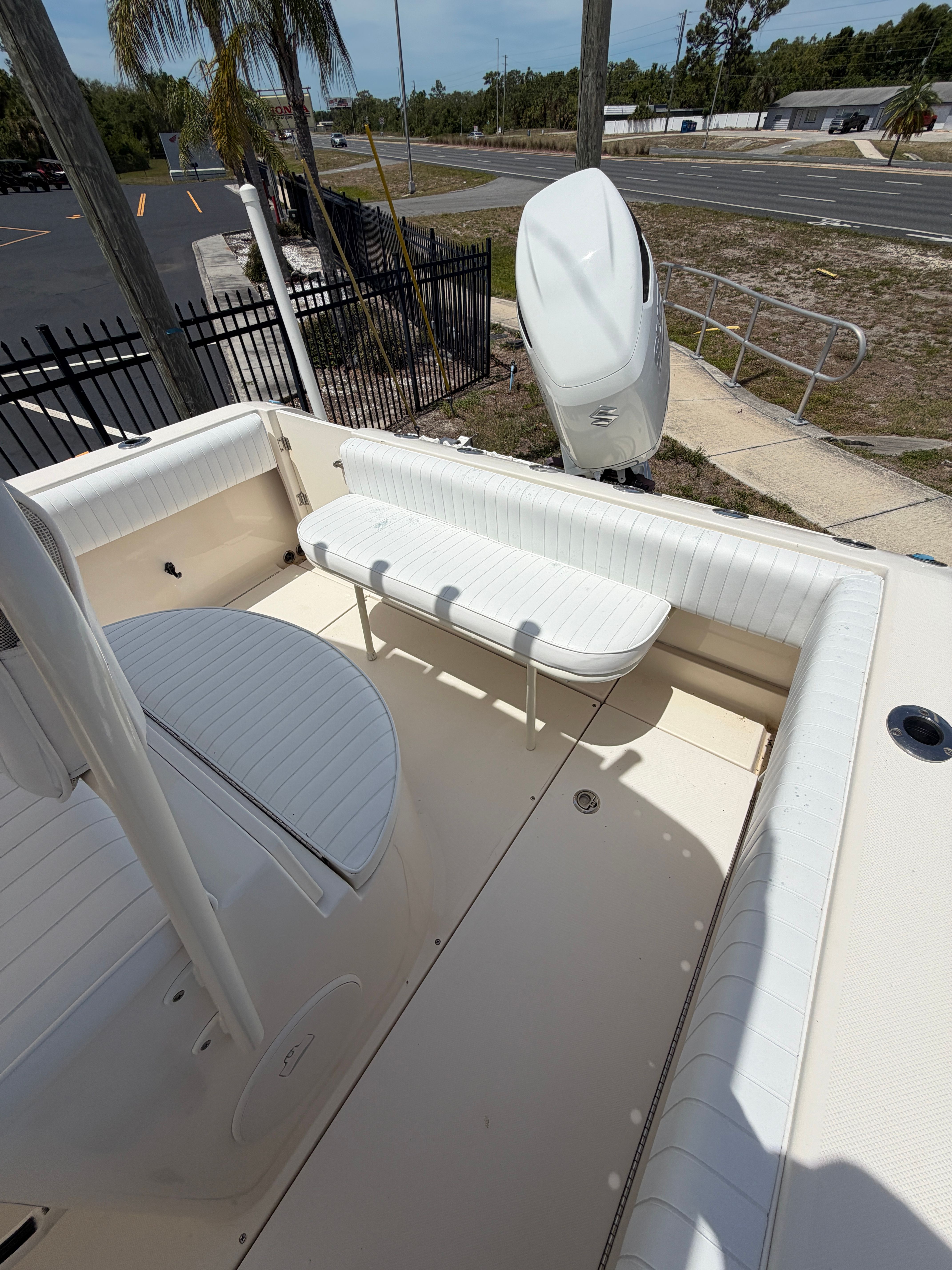 Interior of a 2004 McKee Craft 24 FREEDOM boat with white seating.