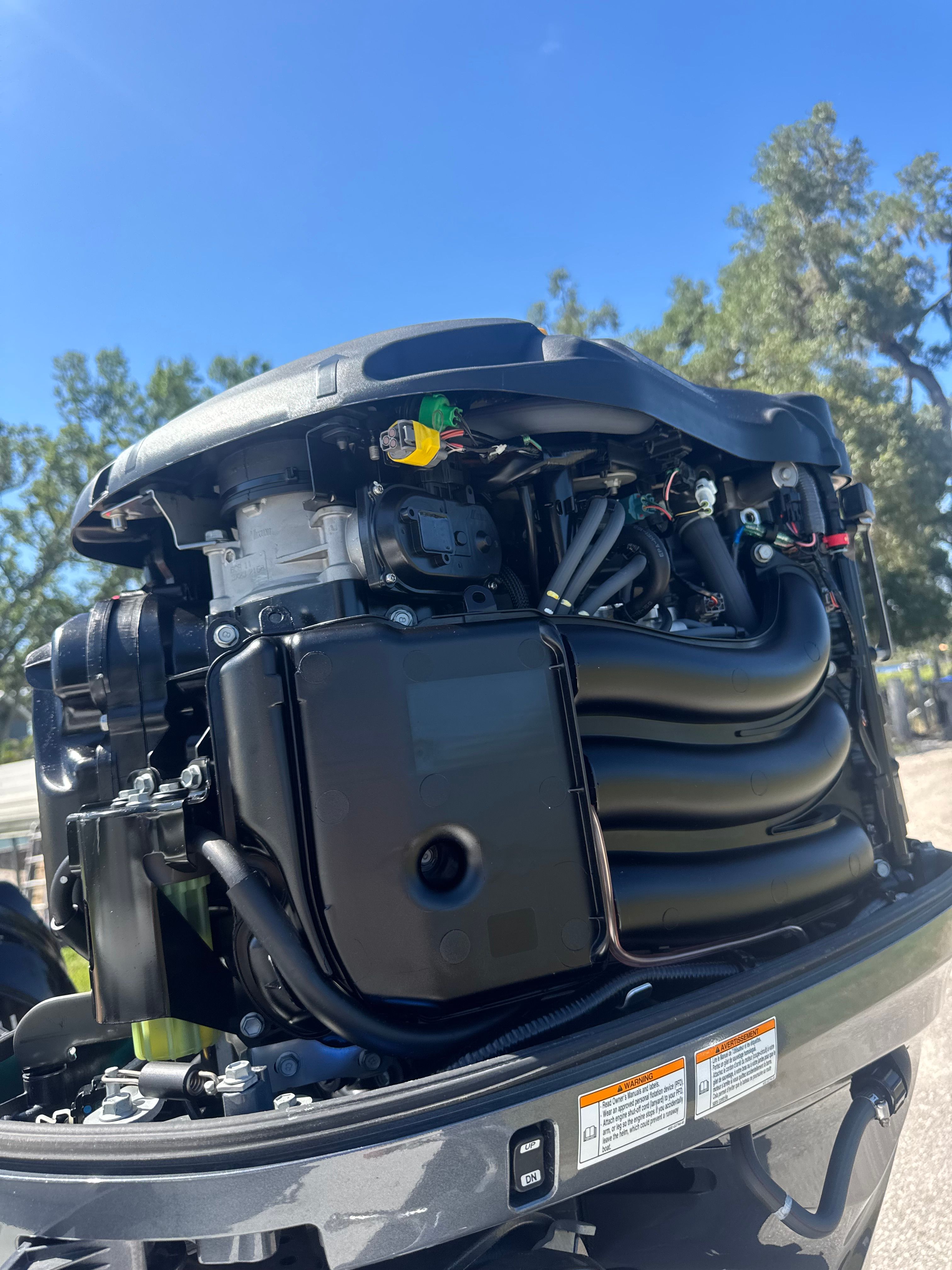 Close-up of a Parker 2520 boat engine, 1997 model, under sunny skies.