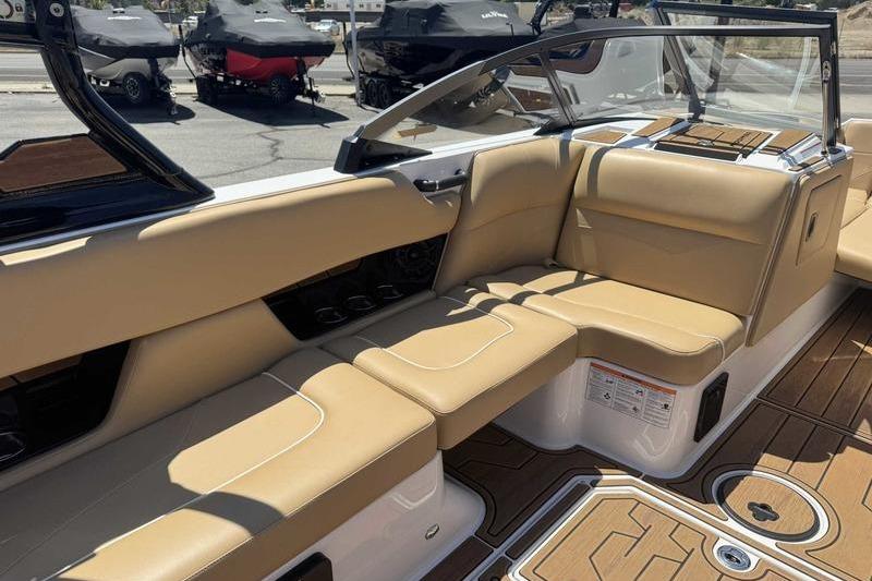 2023 Moomba Mojo Pro boat interior with tan seating and sleek design.