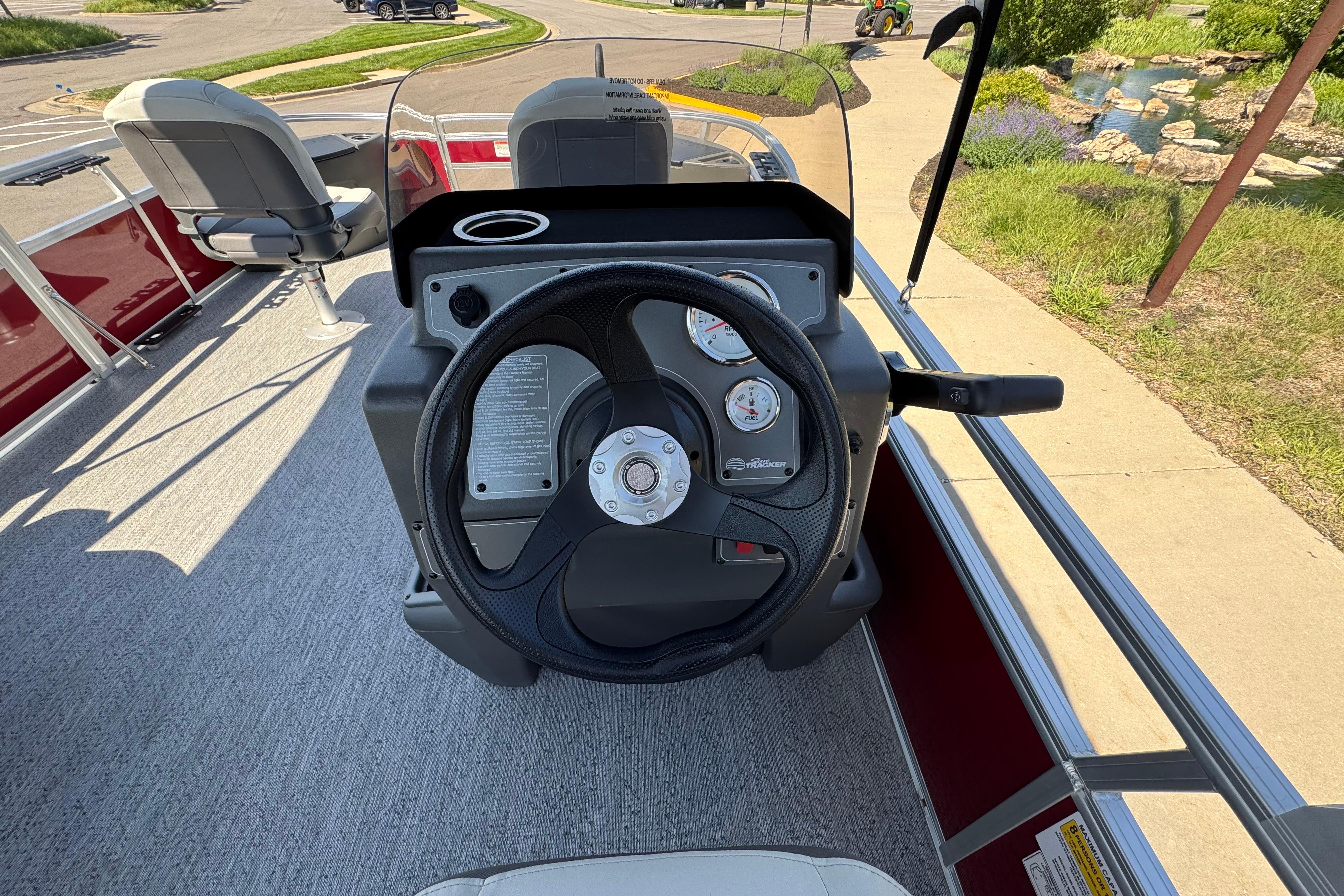 2026 Sun Tracker Bass Buggy 18 DLX steering console with gauges and seating.