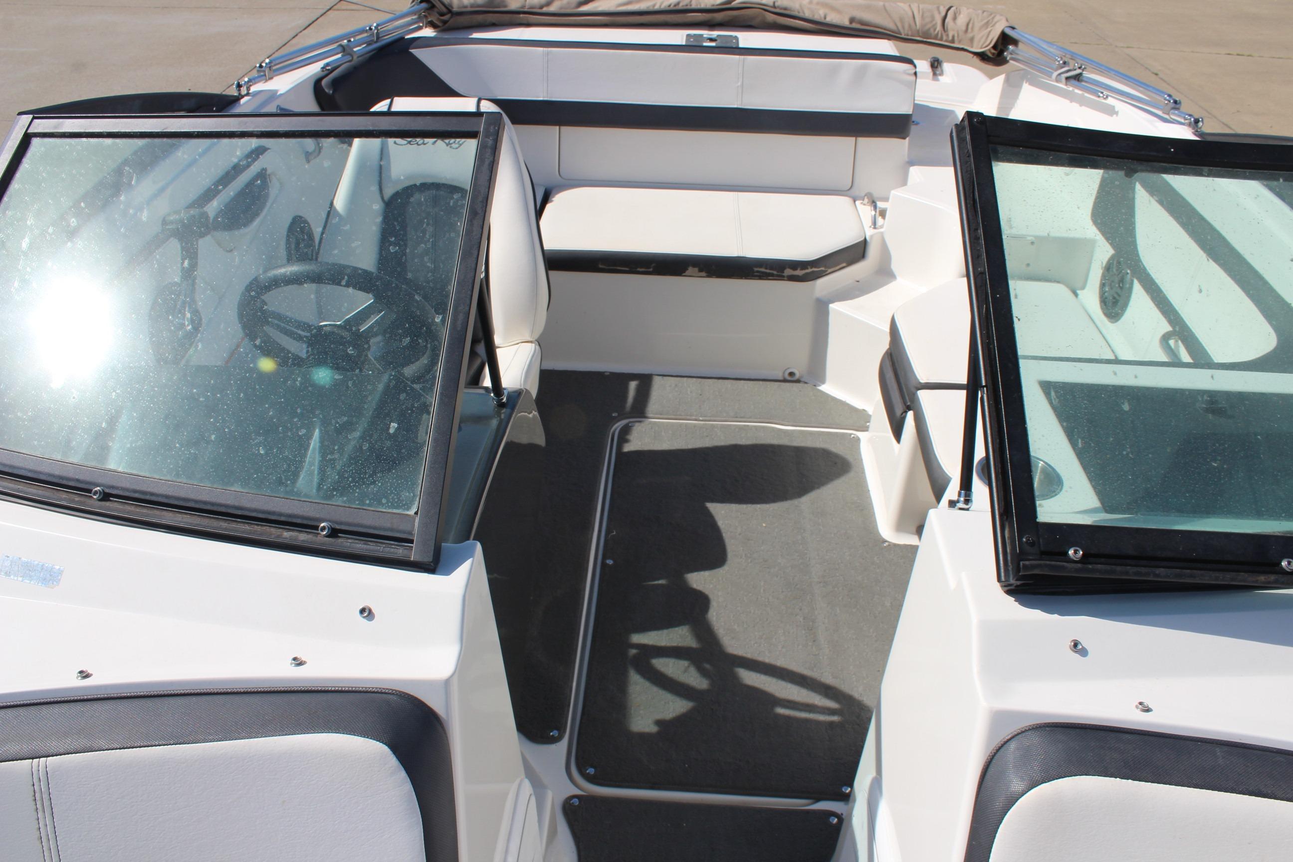 2015 Sea Ray 19 SPX OB boat interior with seating and steering wheel.
