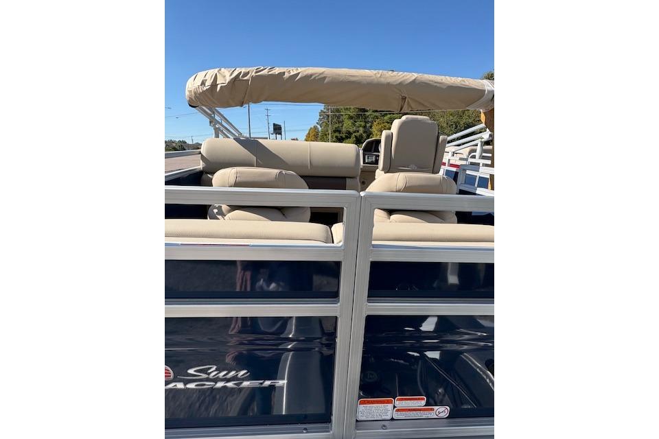 2025 Sun Tracker Fishin' Barge 22 XP3 pontoon boat with beige seating and canopy.