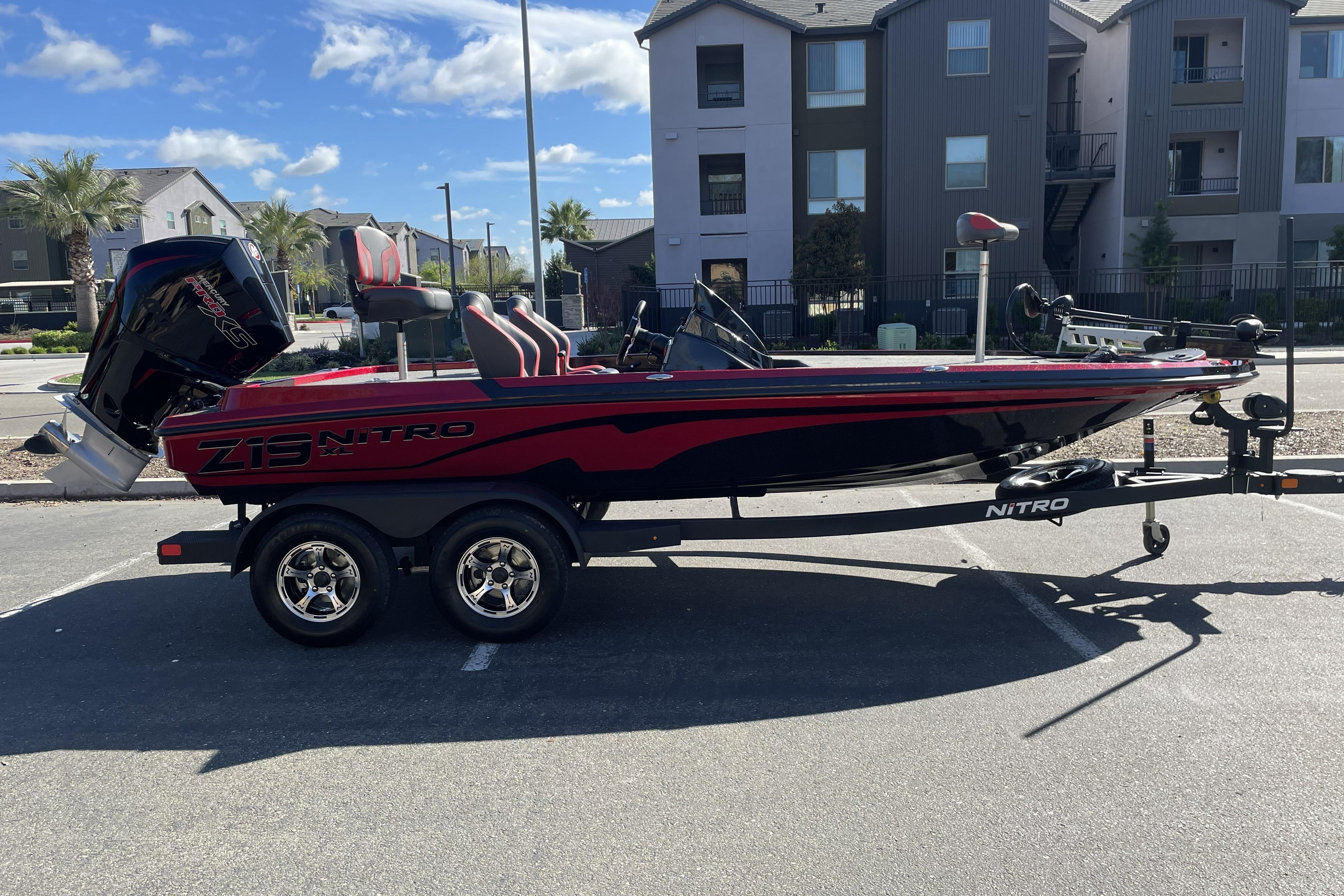 2026 Nitro Z19 XL boat parked in urban setting, showcasing sleek design and modern features.