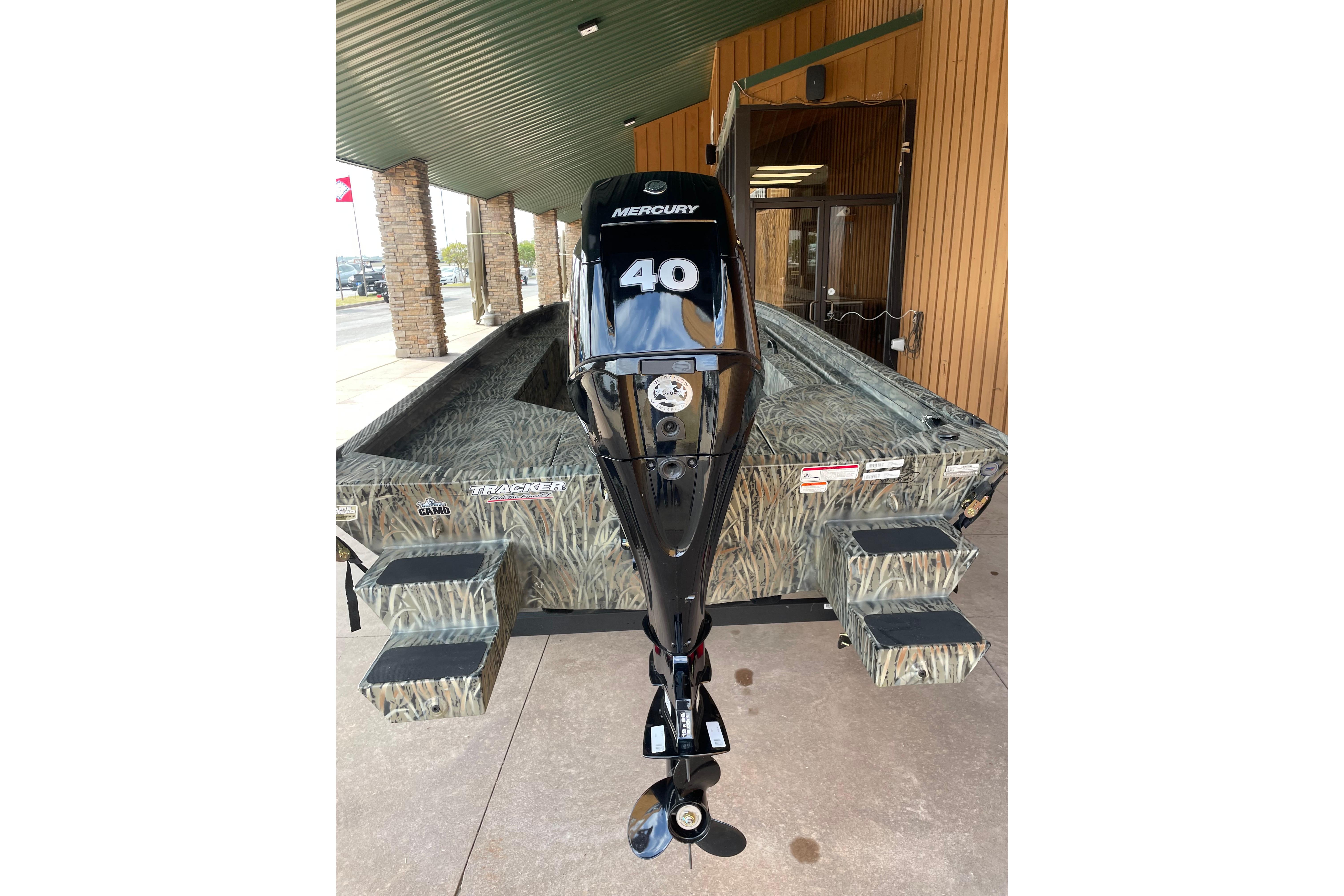 2026 Tracker Grizzly 1654 T Sportsman boat with Mercury 40 engine, camo design.