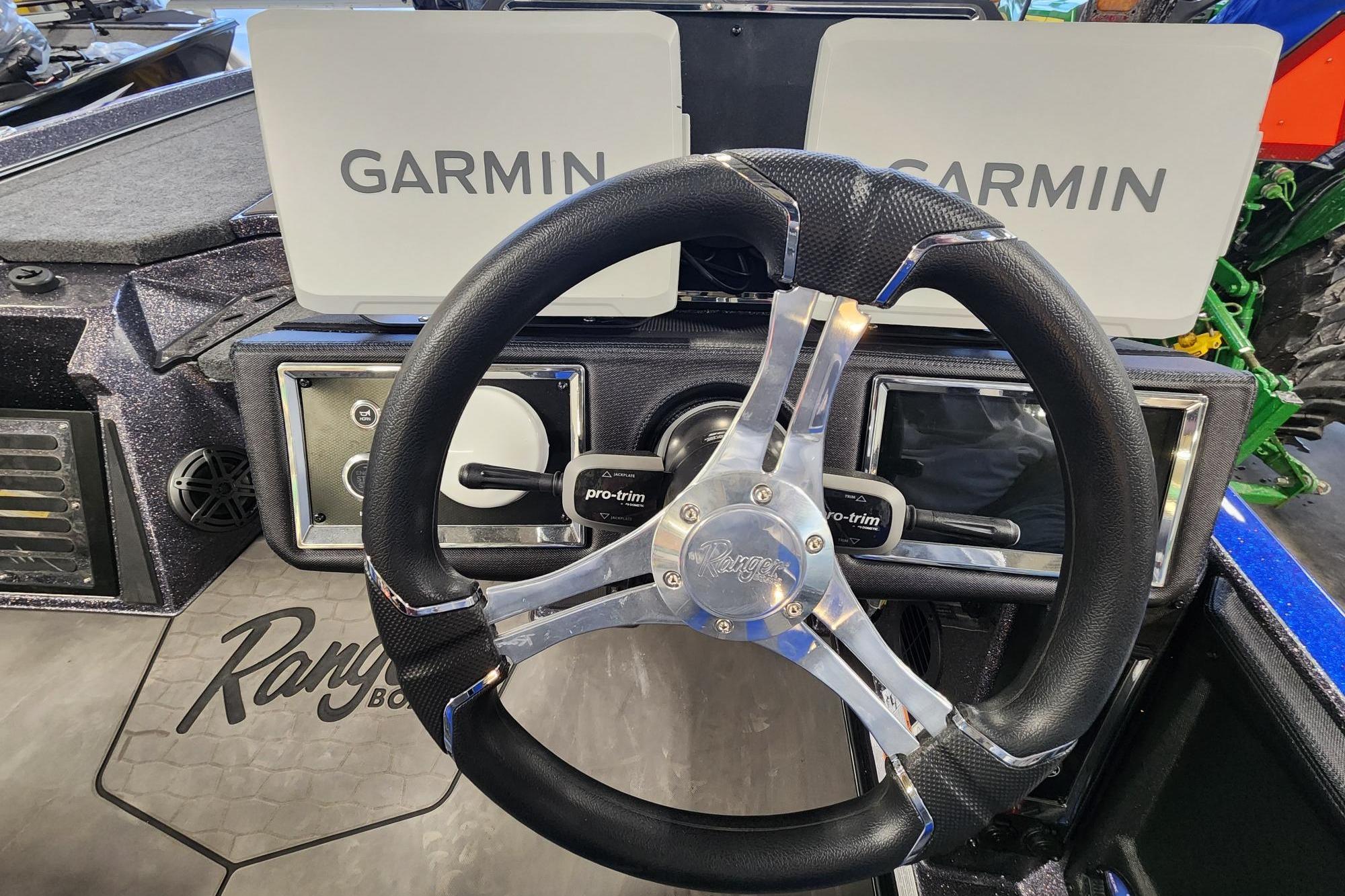 2025 Ranger Z521R boat dashboard with Garmin displays and steering wheel.