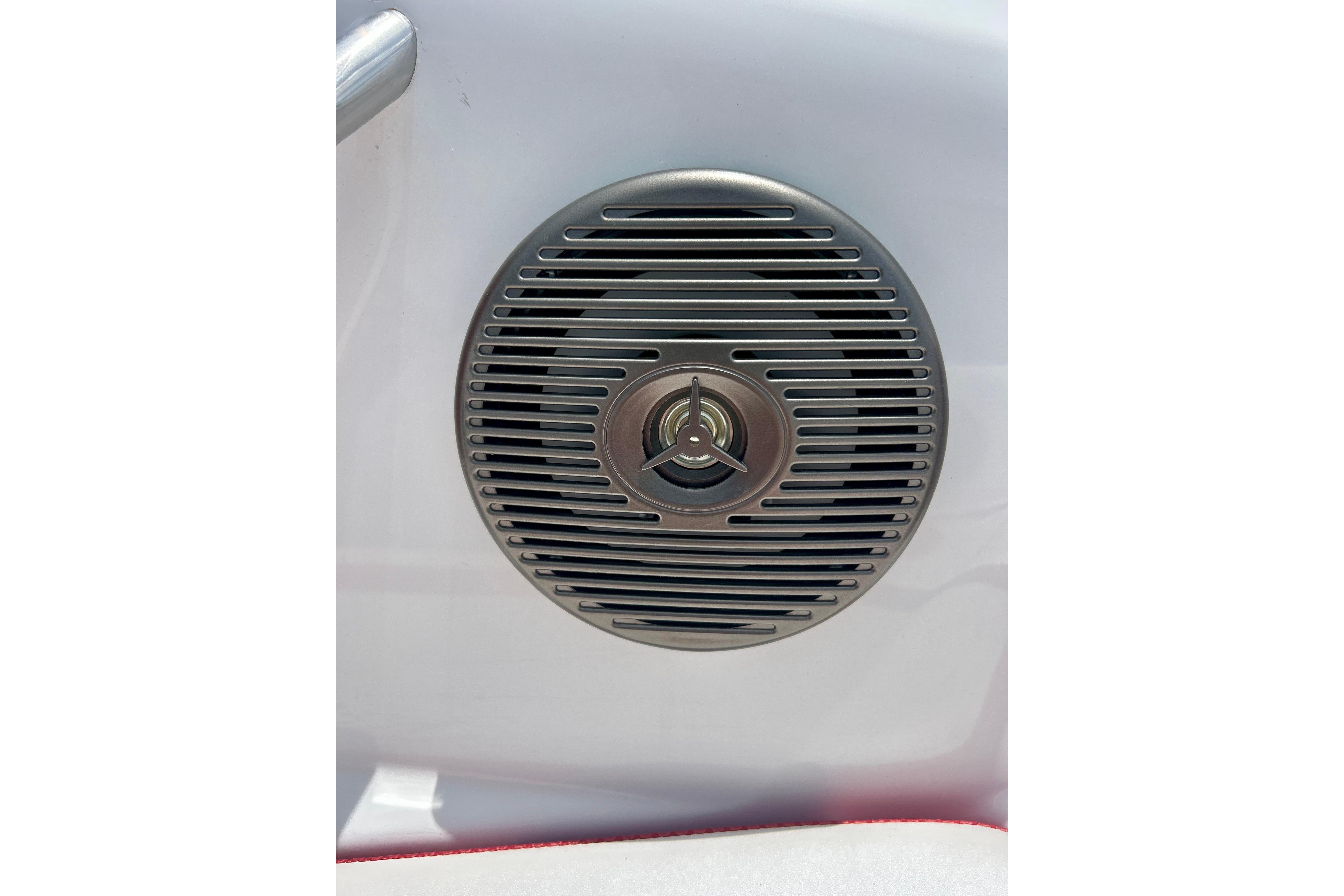 Speaker grille on 2021 Scarab 195 ID boat, featuring sleek metallic design.