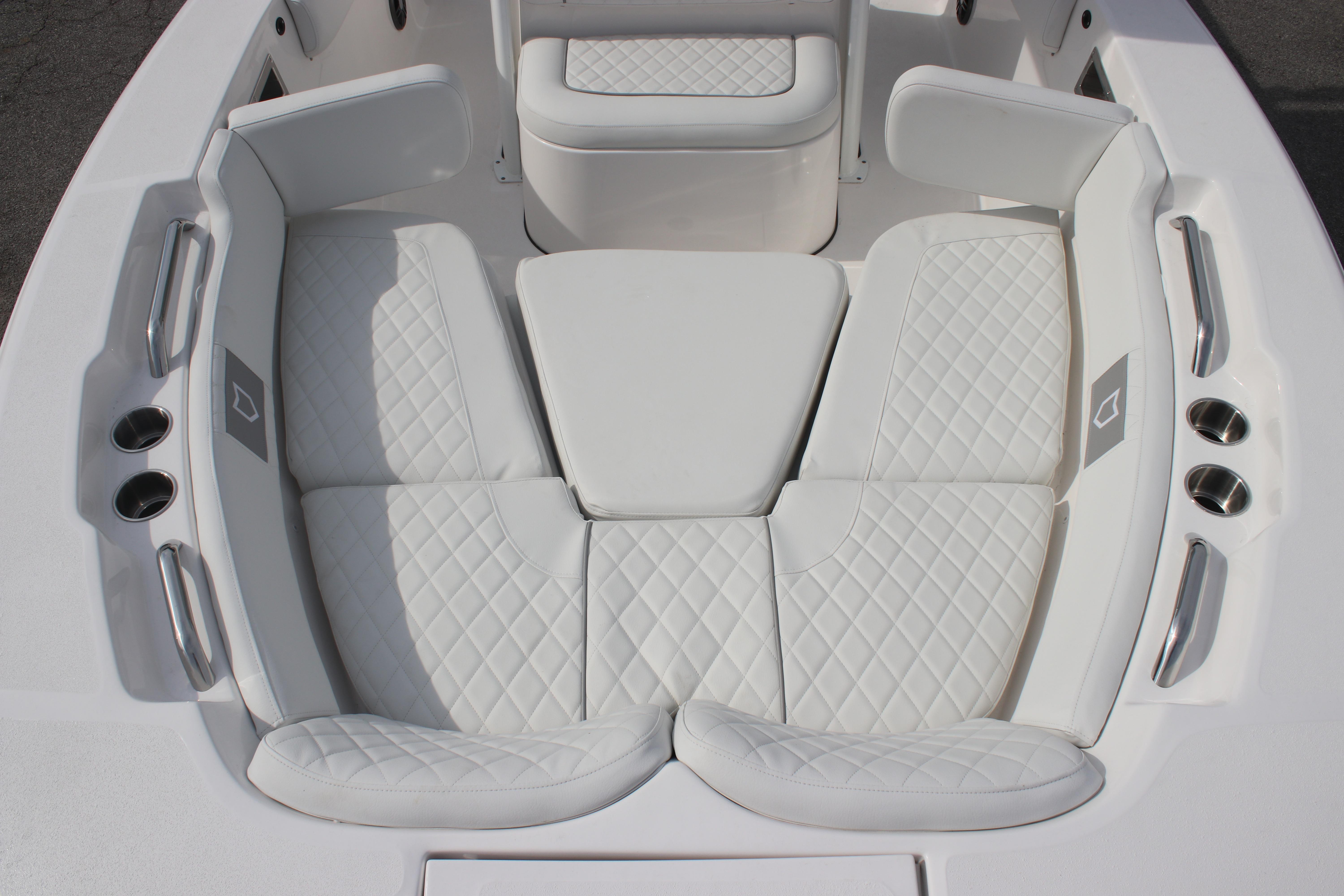 Luxurious seating on 2026 Sea Fox 248 Commander boat with quilted white upholstery.