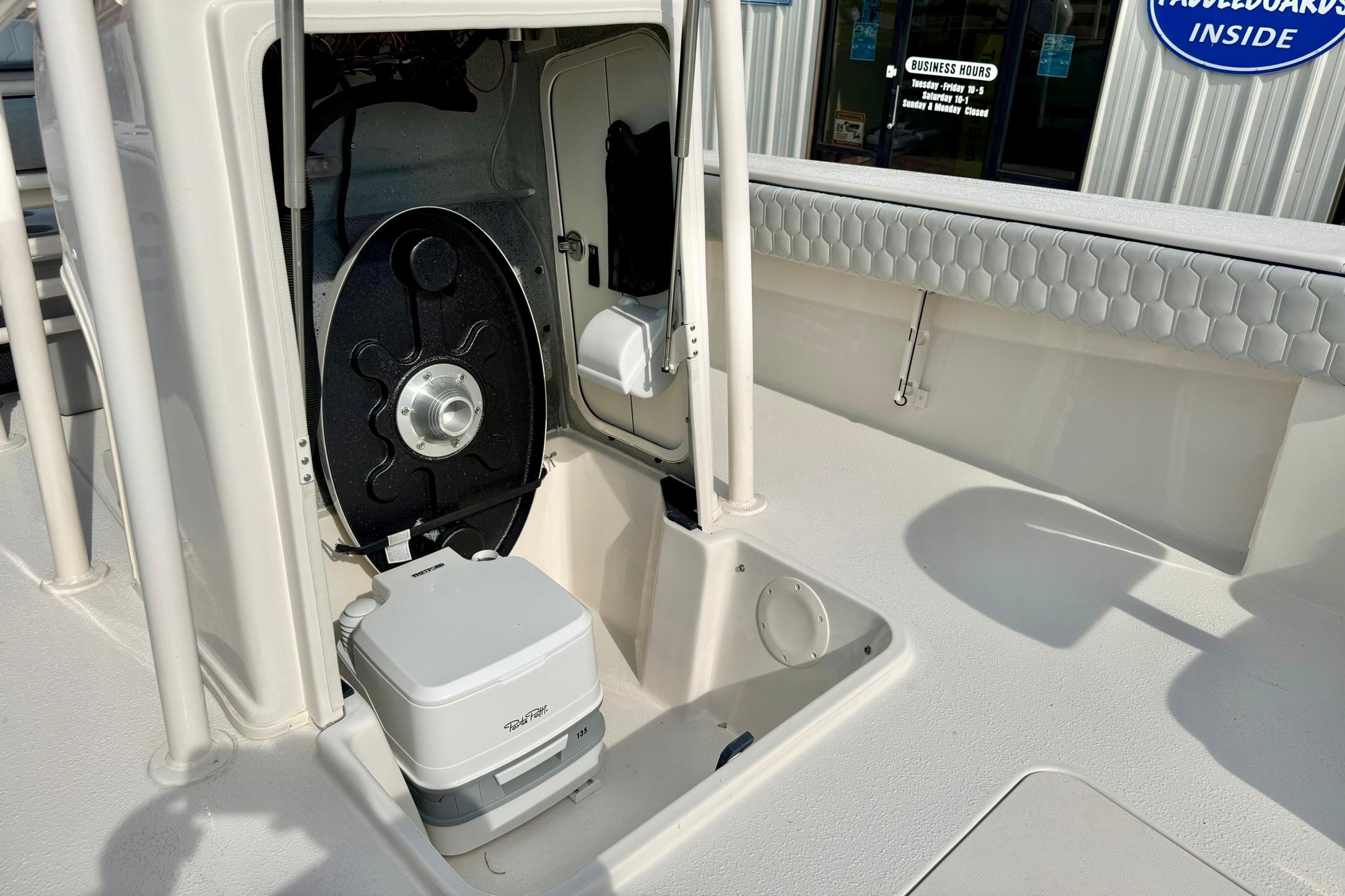 2026 Carolina Skiff 24 Ultra Elite boat interior with storage and seating features.