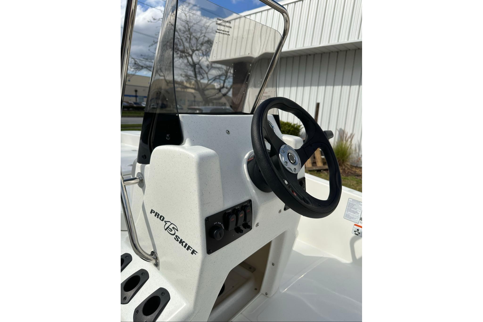 2026 Mako Pro Skiff 17 CC boat console with steering wheel and controls.