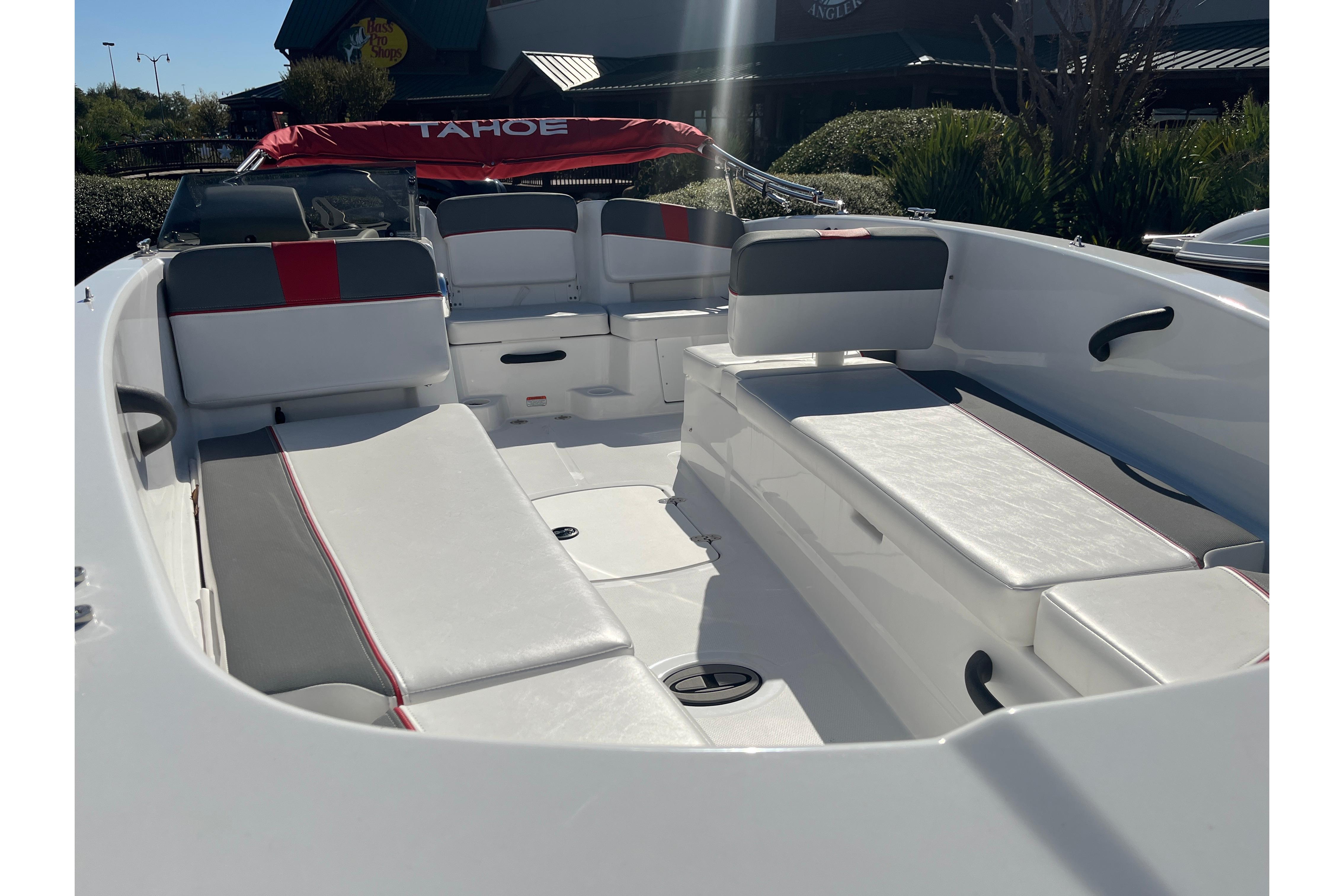 2026 Tahoe T18 boat interior with white and gray seating, red accents, and open deck layout.