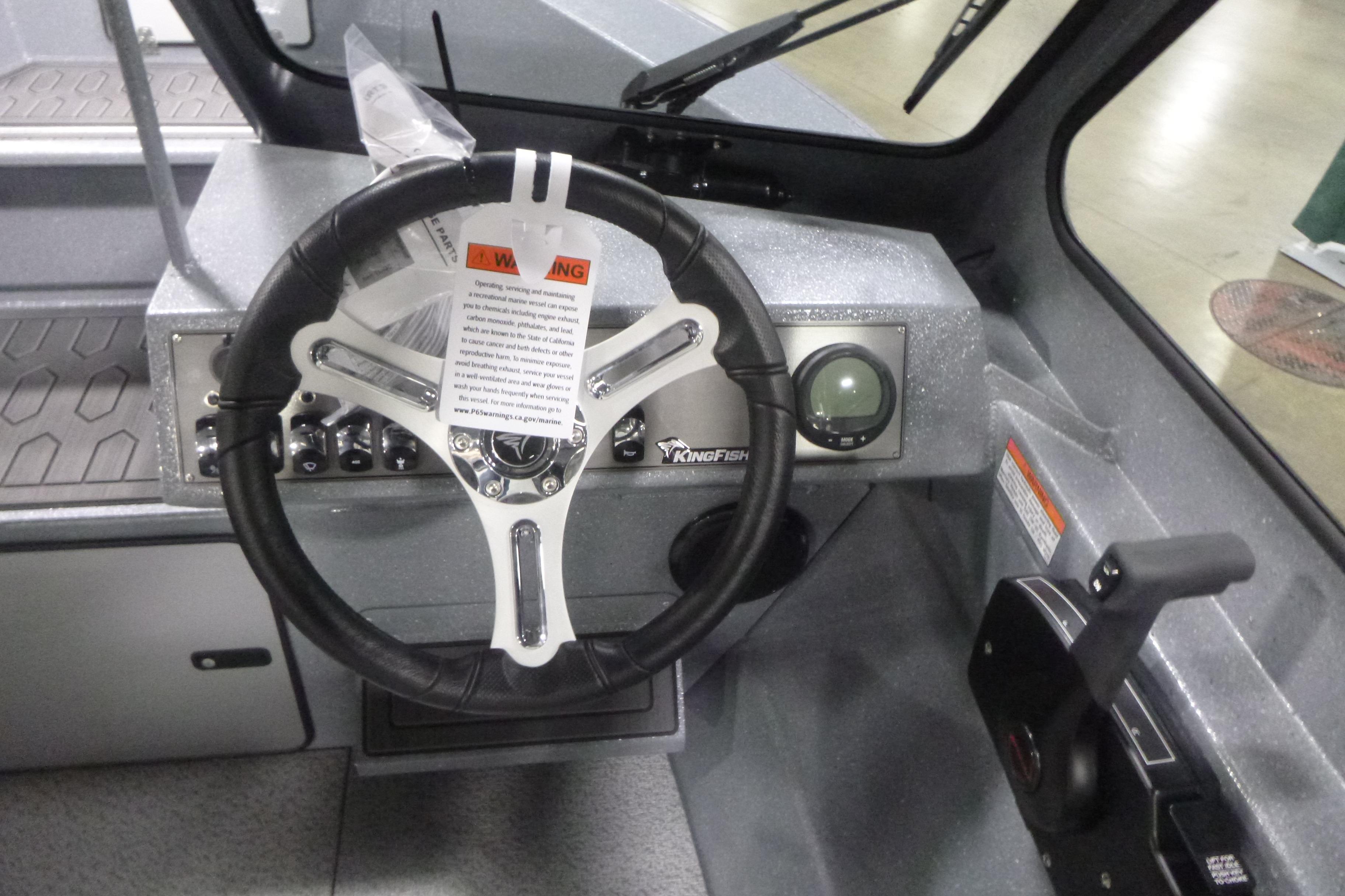 Steering wheel and dashboard of 2026 KingFisher 2025 Falcon boat.