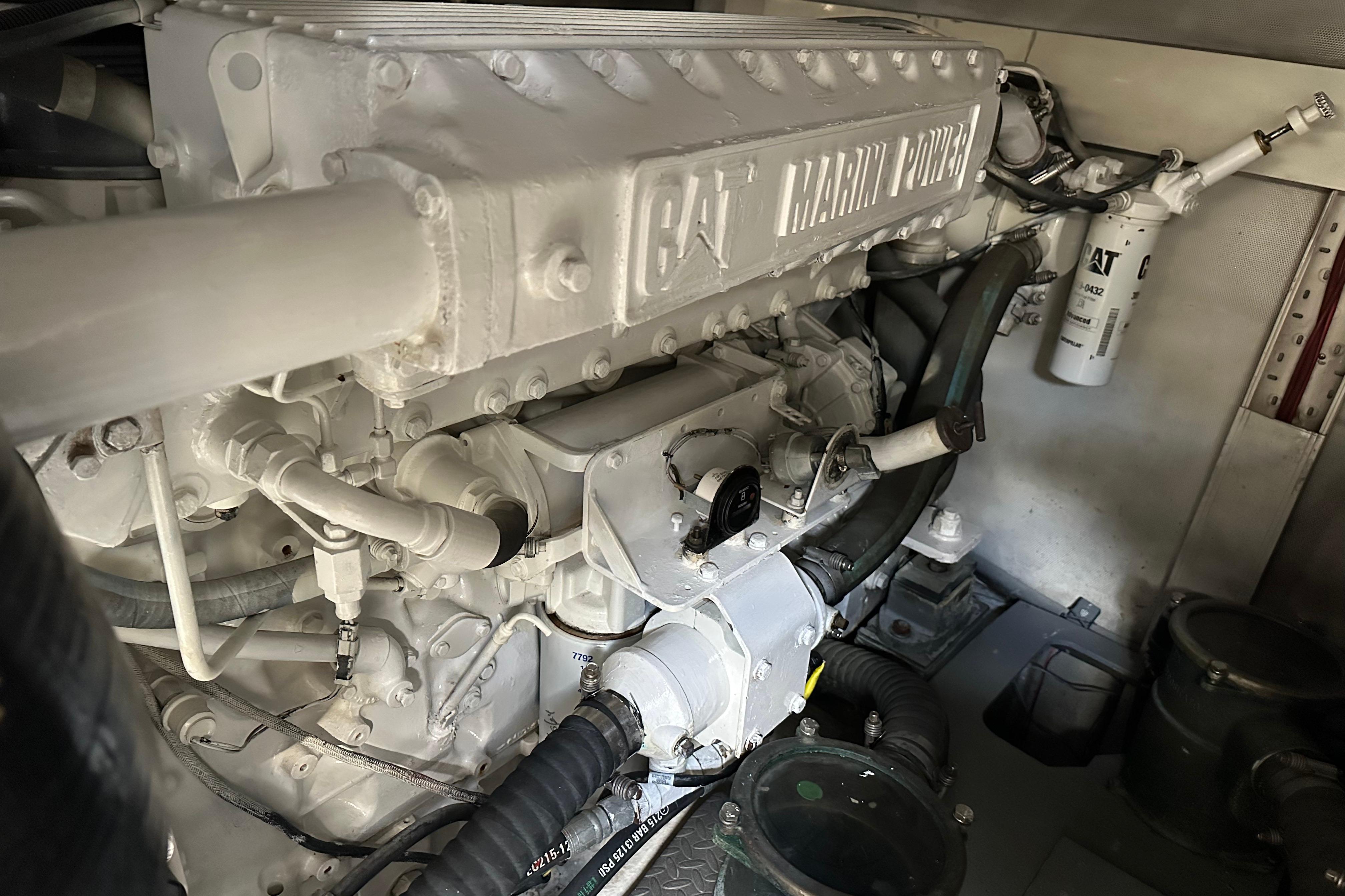 Engine room of a 2004 Azimut 55E yacht featuring a CAT marine power engine.