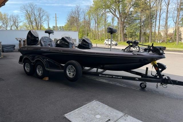 2026 Ranger Z519R bass boat on trailer, parked outdoors with trees in background.